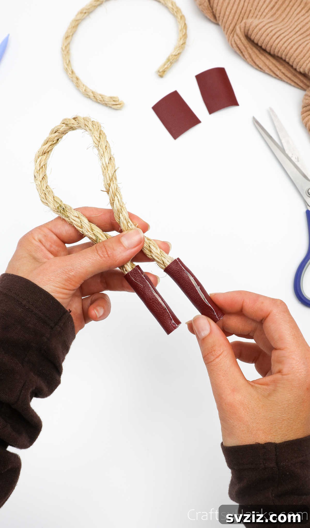 Completed rope handle with leather embellishment