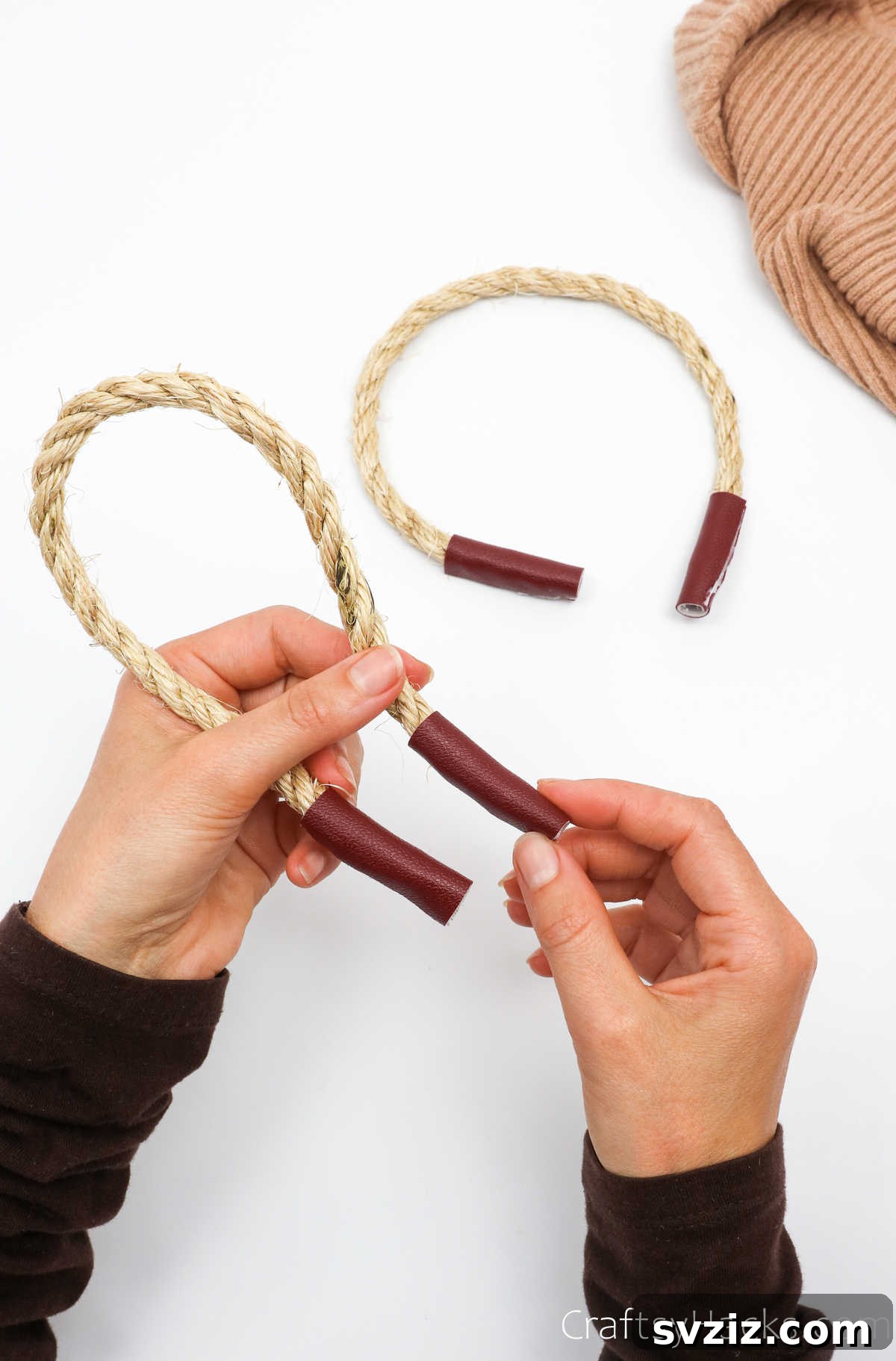 Holding down the embellished ends of rope handles