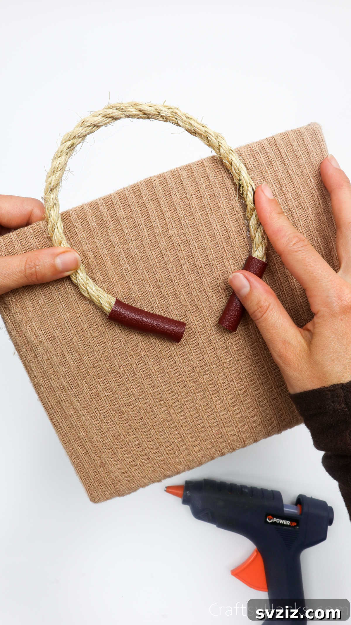 Attaching the second end of a rope handle to the box