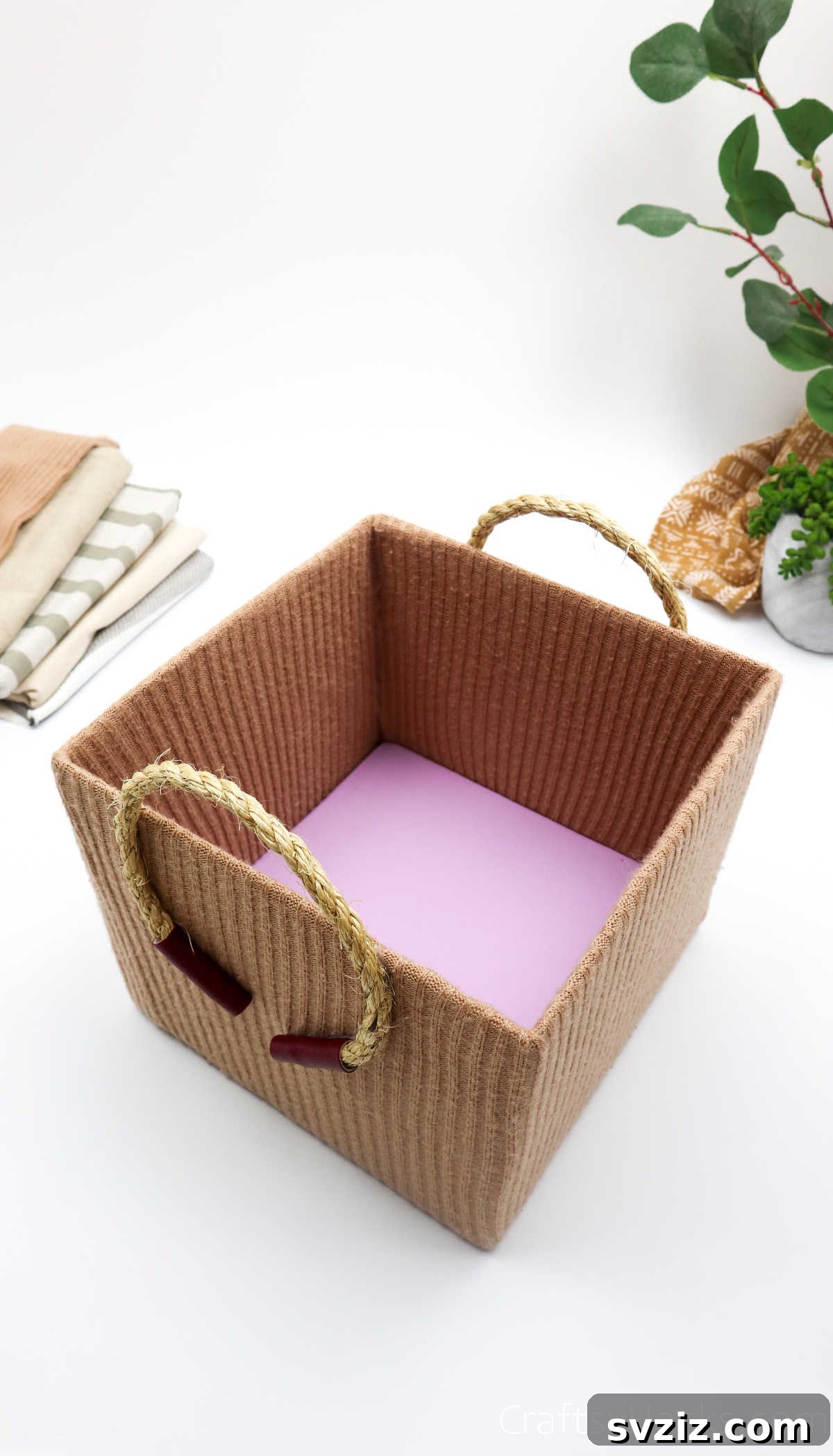 A beautifully finished DIY storage box made from an old sweater