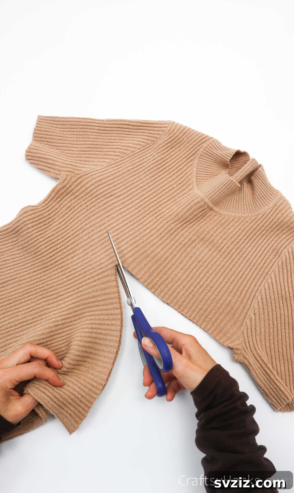 Cutting an old sweater below the arms