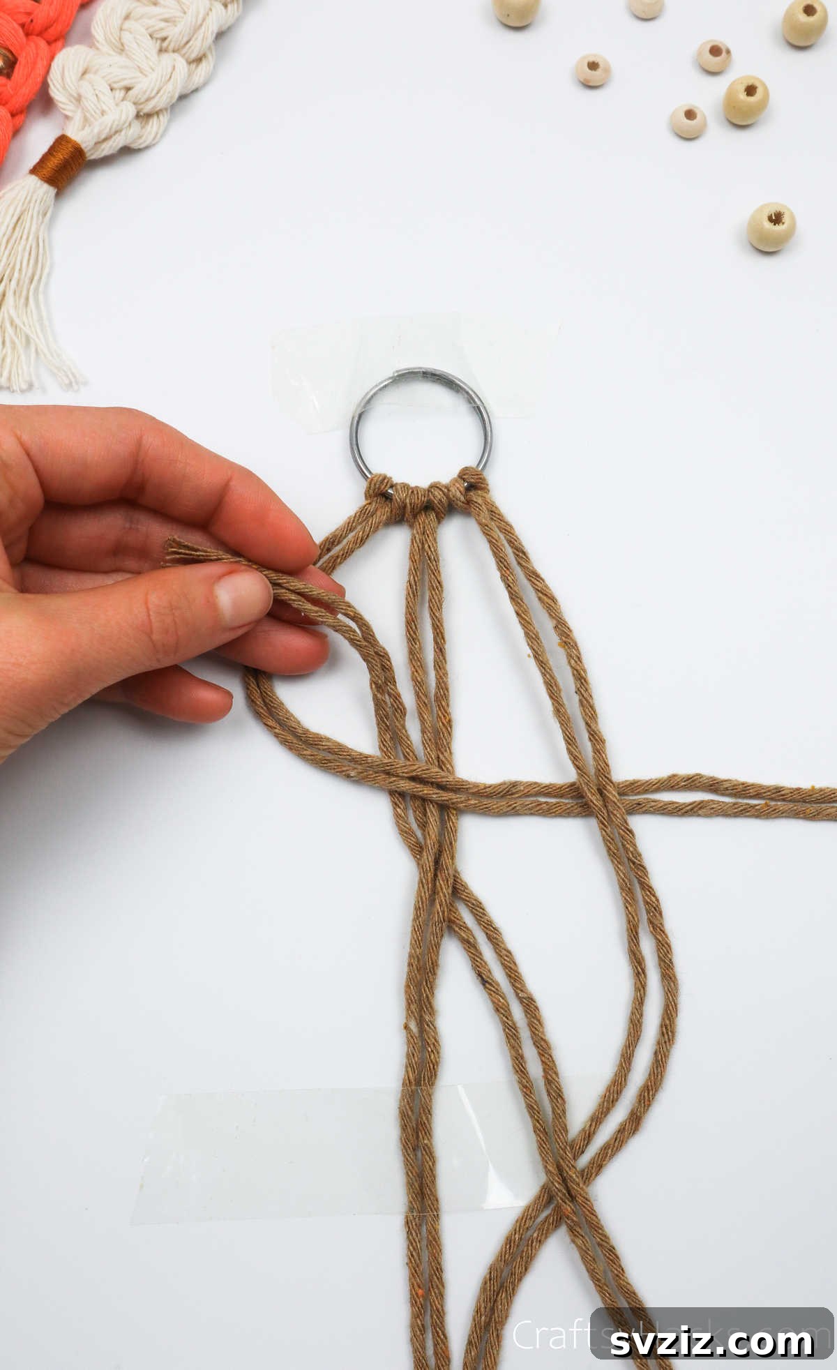 The right cords emerge through the loop, ready to be tightened.
