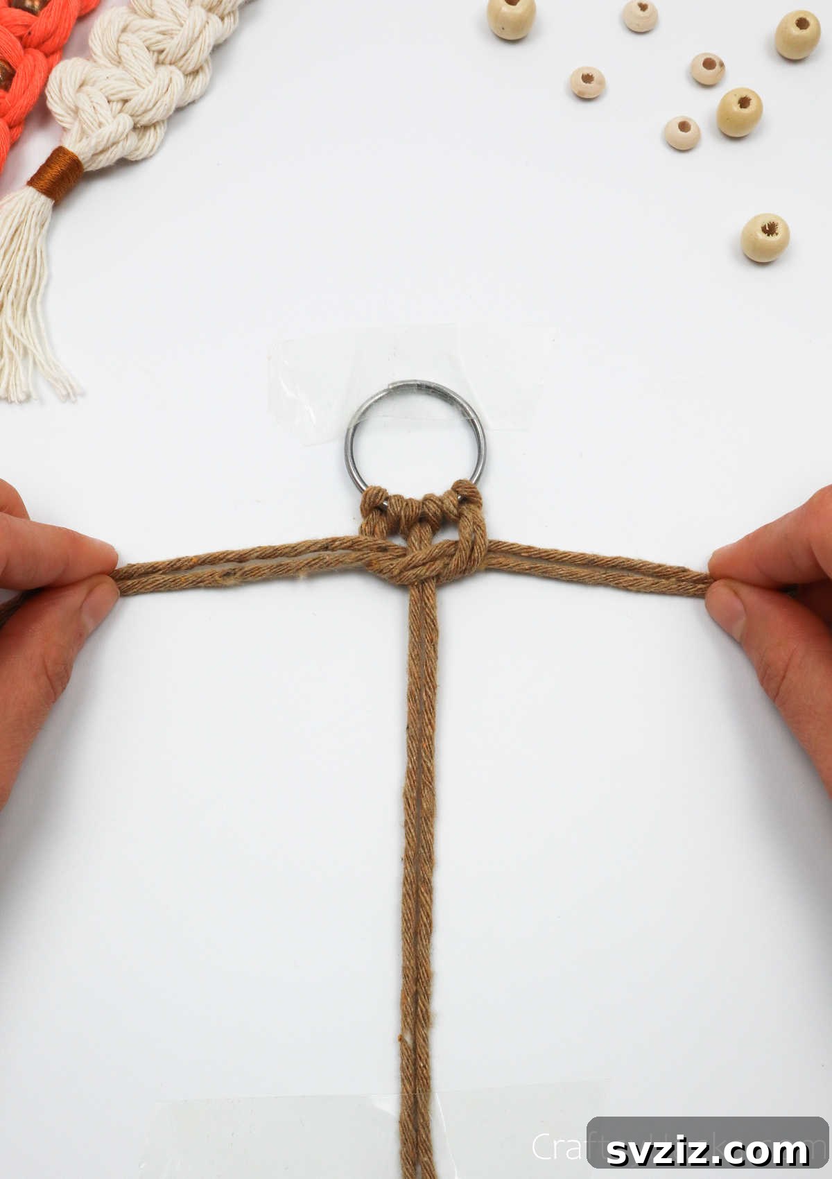 A closer view of the completed first half of the macrame square knot.