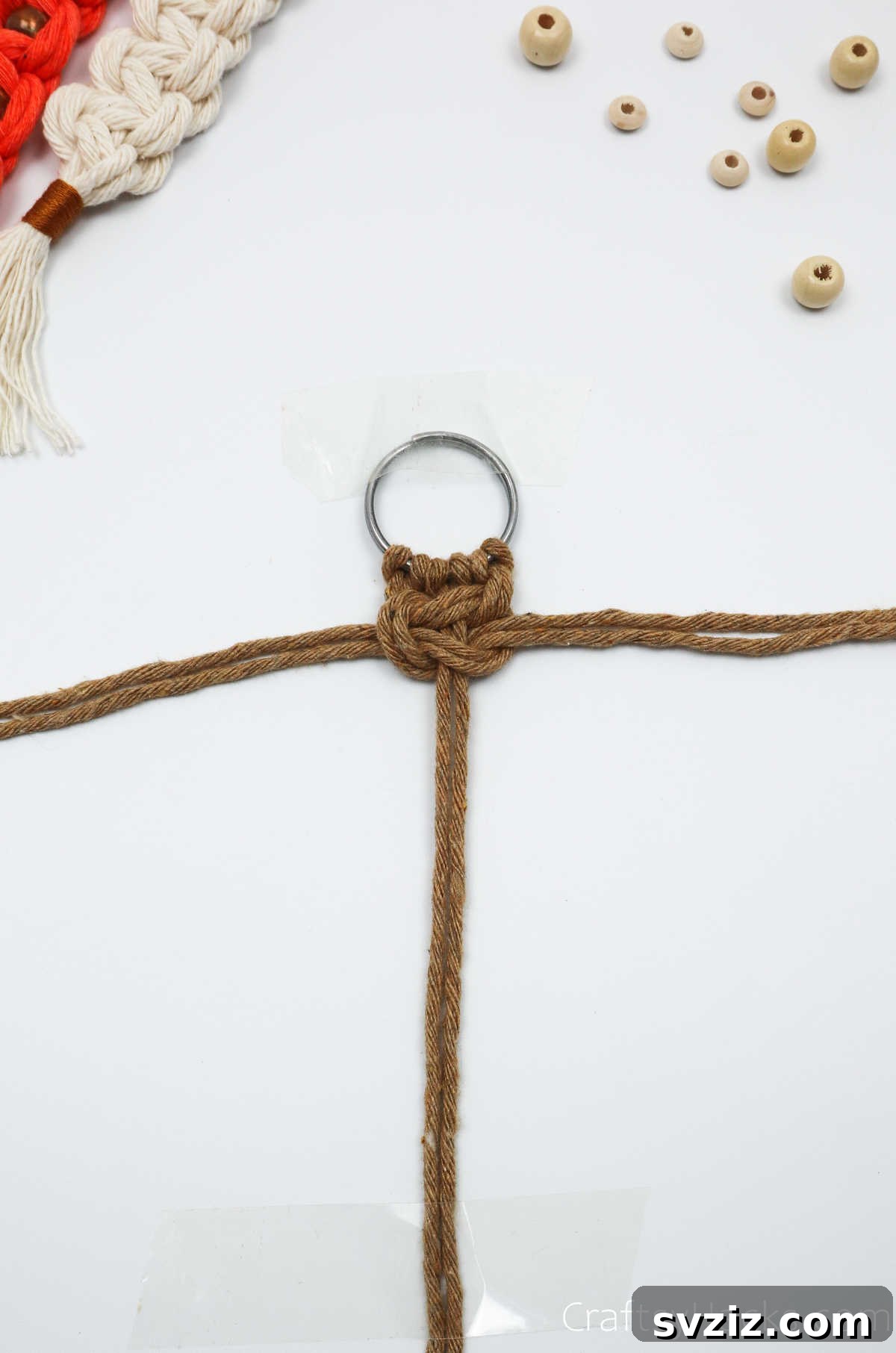 A perfectly formed macrame square knot, the first design element of the keychain.