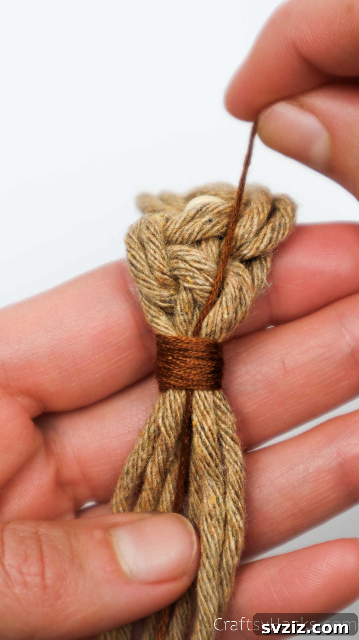 The finishing wrap is securely tightened, creating a neat bundle of cords.