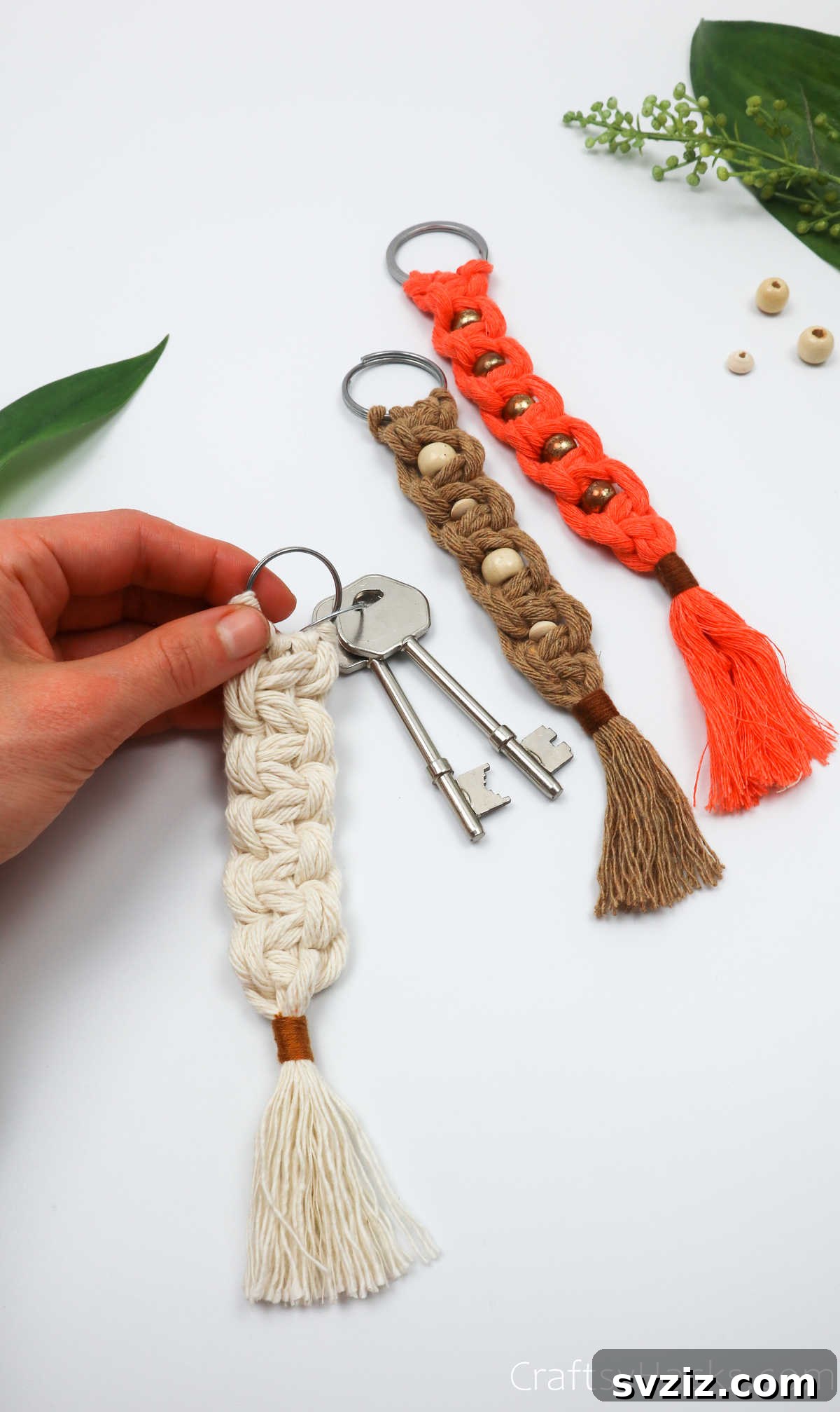 A completed macrame keychain attached to a set of keys, ready for use.