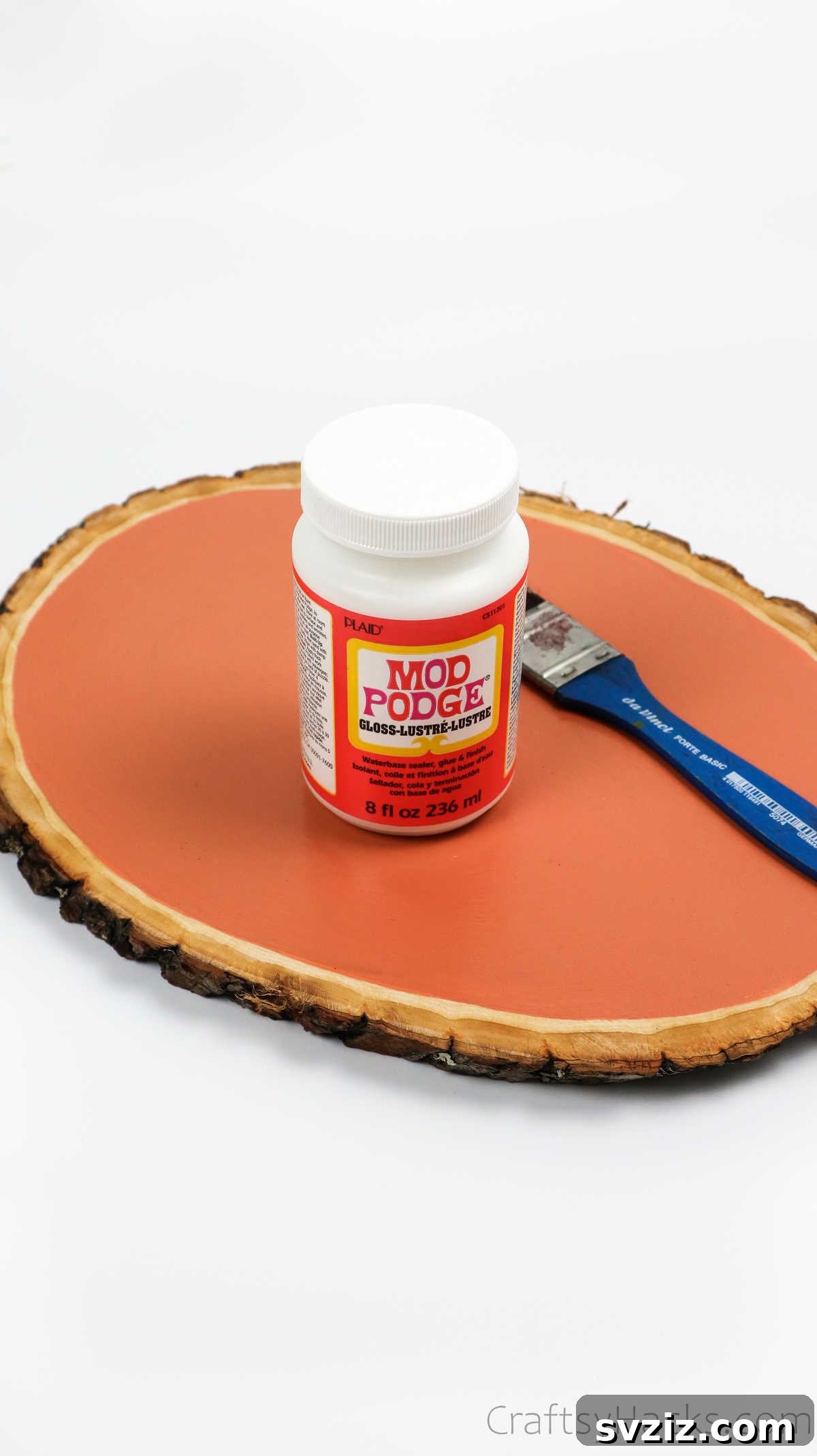 Eco-Chic Desk Organizer from Kitchen Recyclables 18 brushing Mod Podge onto wood base