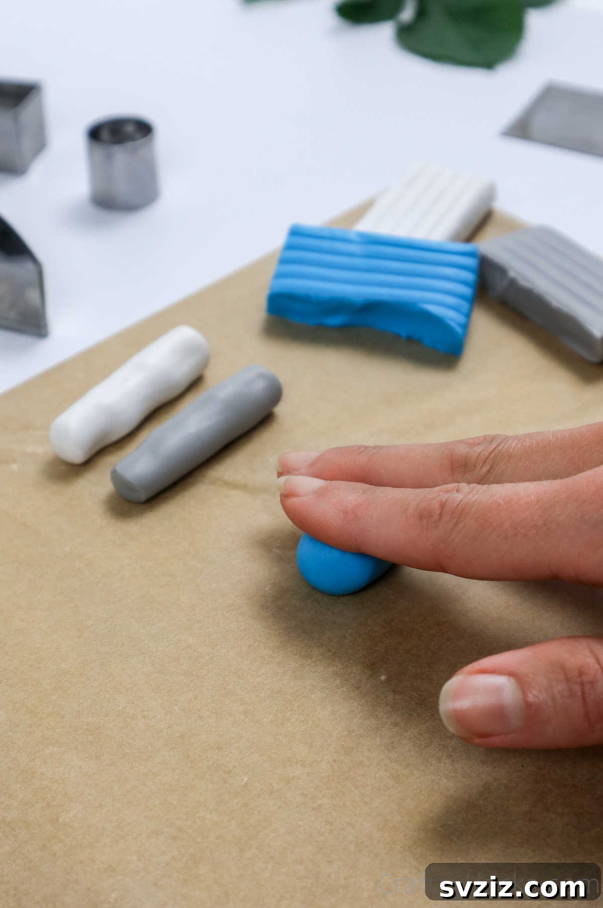 Craft Your Own Polymer Clay Earrings 12 Rolling blue polymer clay into a cylindrical strip