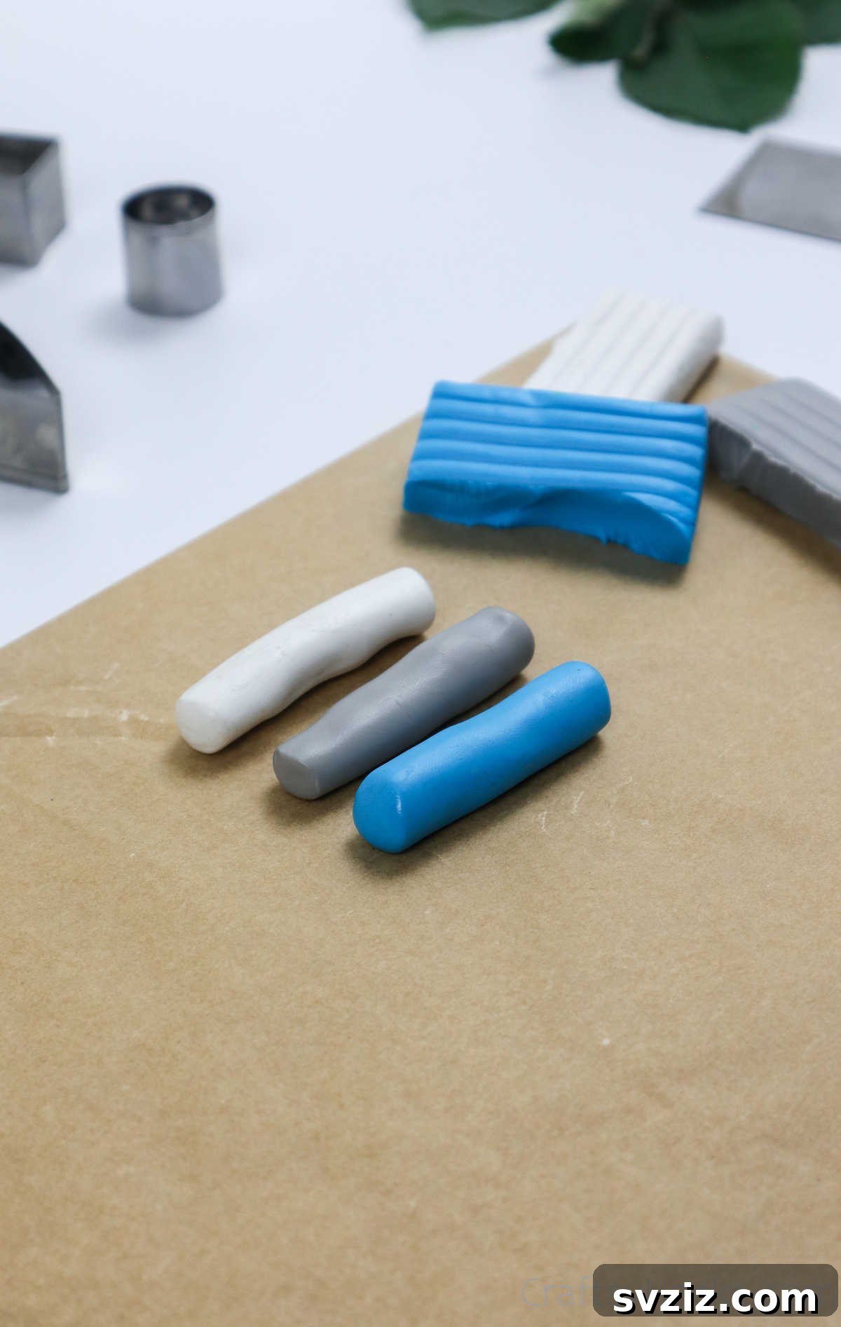 Craft Your Own Polymer Clay Earrings 13 Three cylindrical rolls of polymer clay in different colors