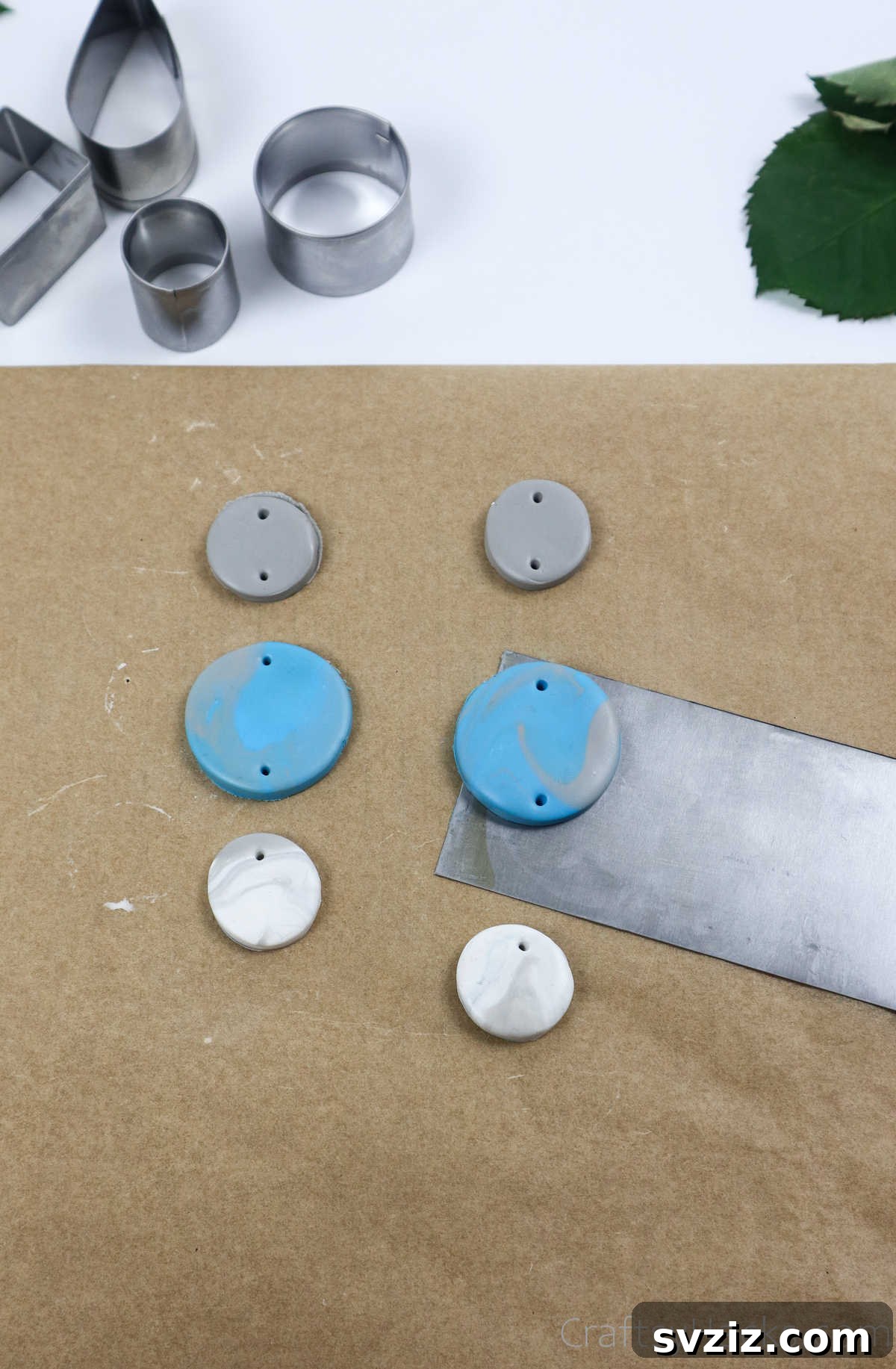 Craft Your Own Polymer Clay Earrings 31 Removing finished solid-colored clay earrings from paper