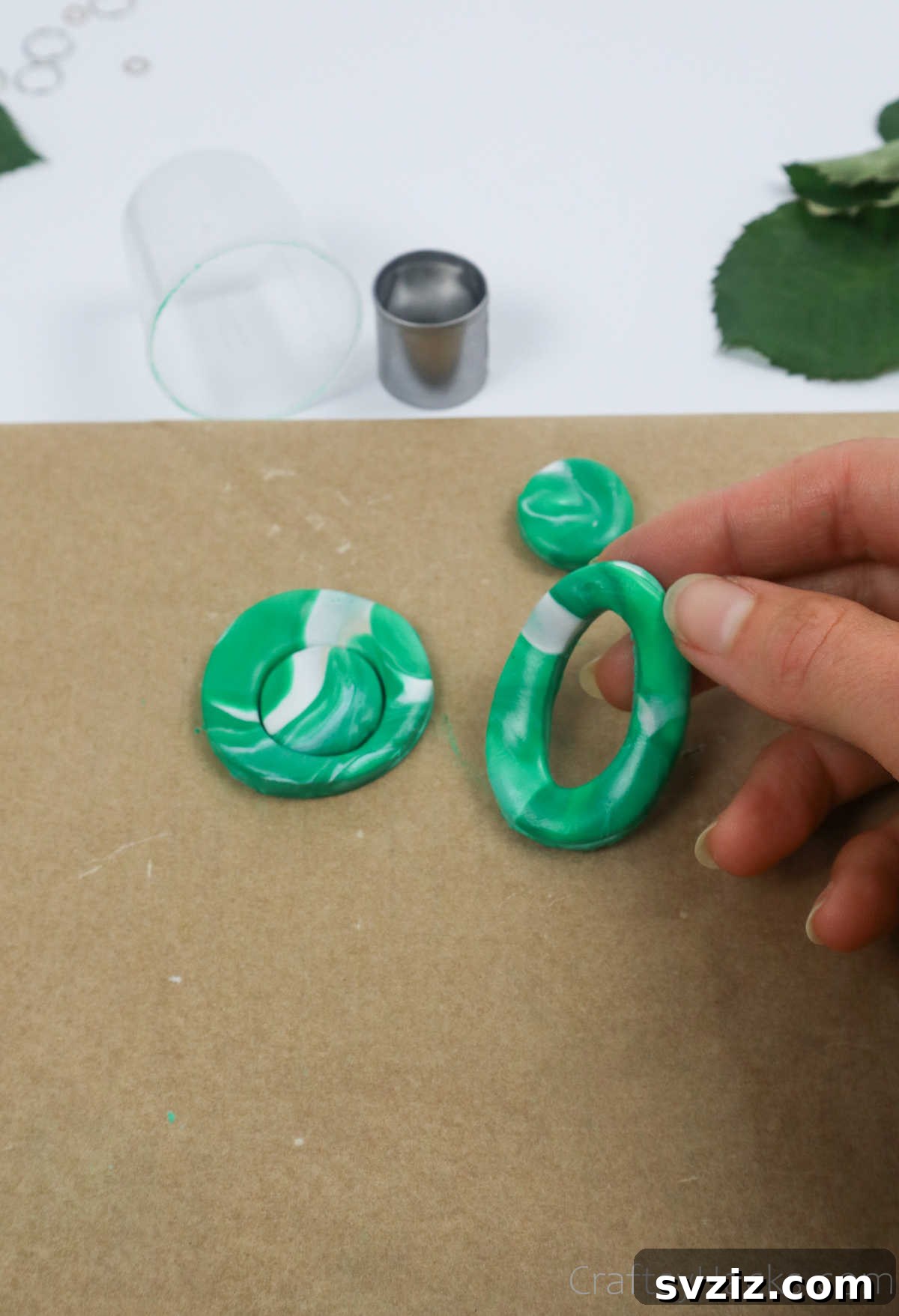 Craft Your Own Polymer Clay Earrings 36 Holding a partially assembled two-piece polymer clay earring