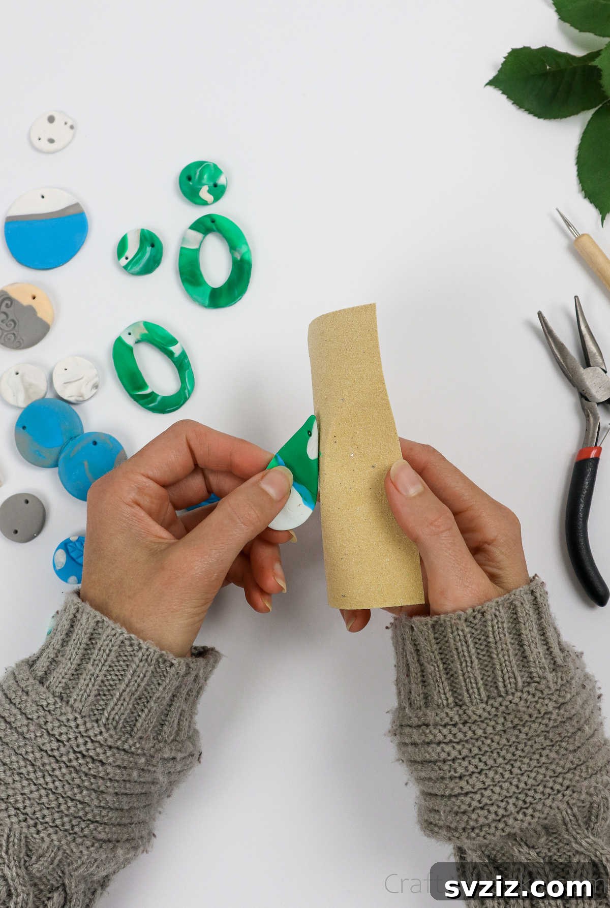 Craft Your Own Polymer Clay Earrings 54 Sanding the edges of a polymer clay earring