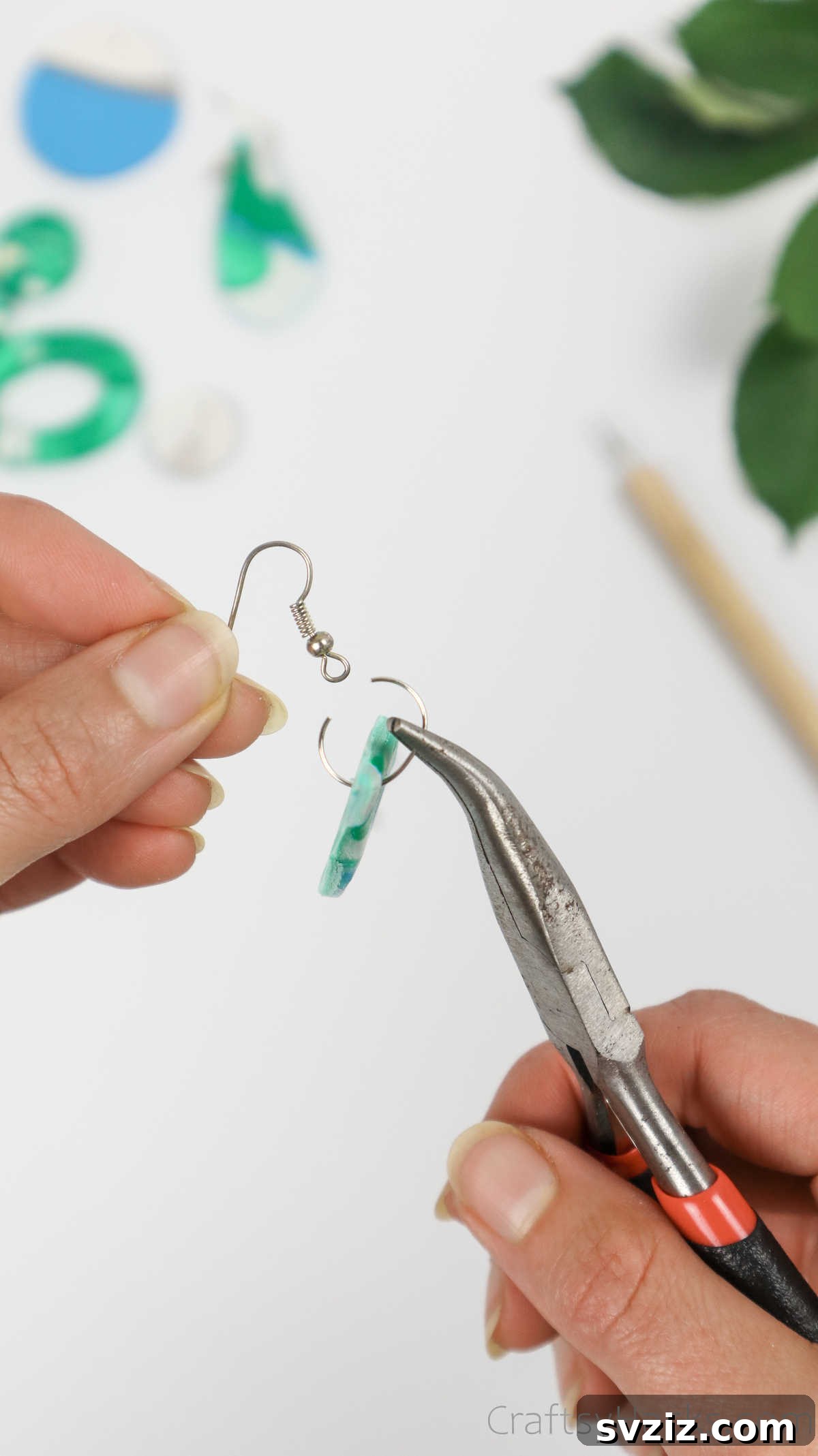 Craft Your Own Polymer Clay Earrings 59 Attaching an earring hook to a jump ring on a clay earring