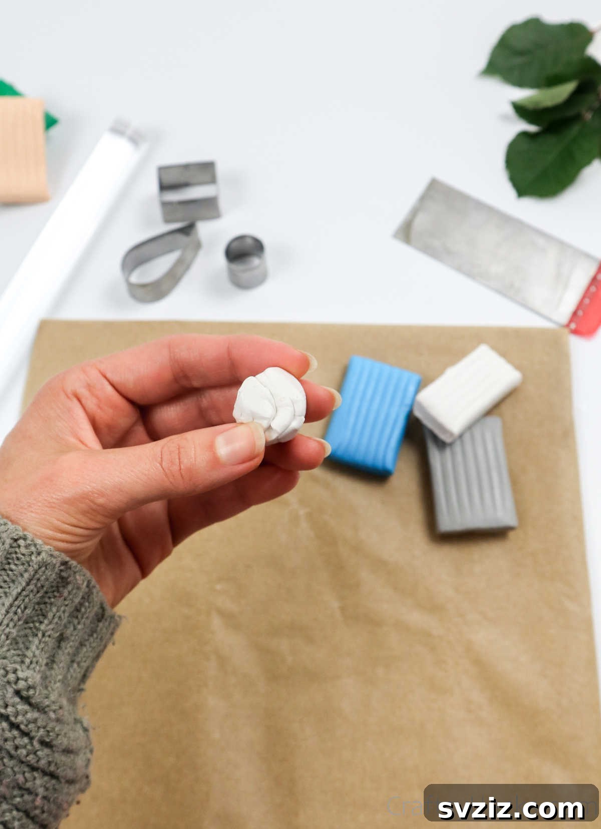 Craft Your Own Polymer Clay Earrings 9 Rolling a ball of white polymer clay