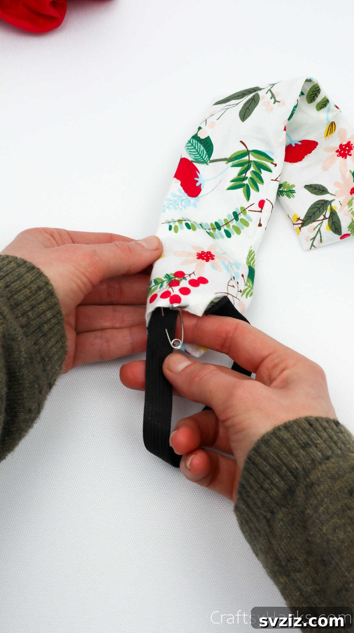 Craft Your Perfect Hair Scrunchie 17 Guiding elastic with a safety pin through the fabric tube