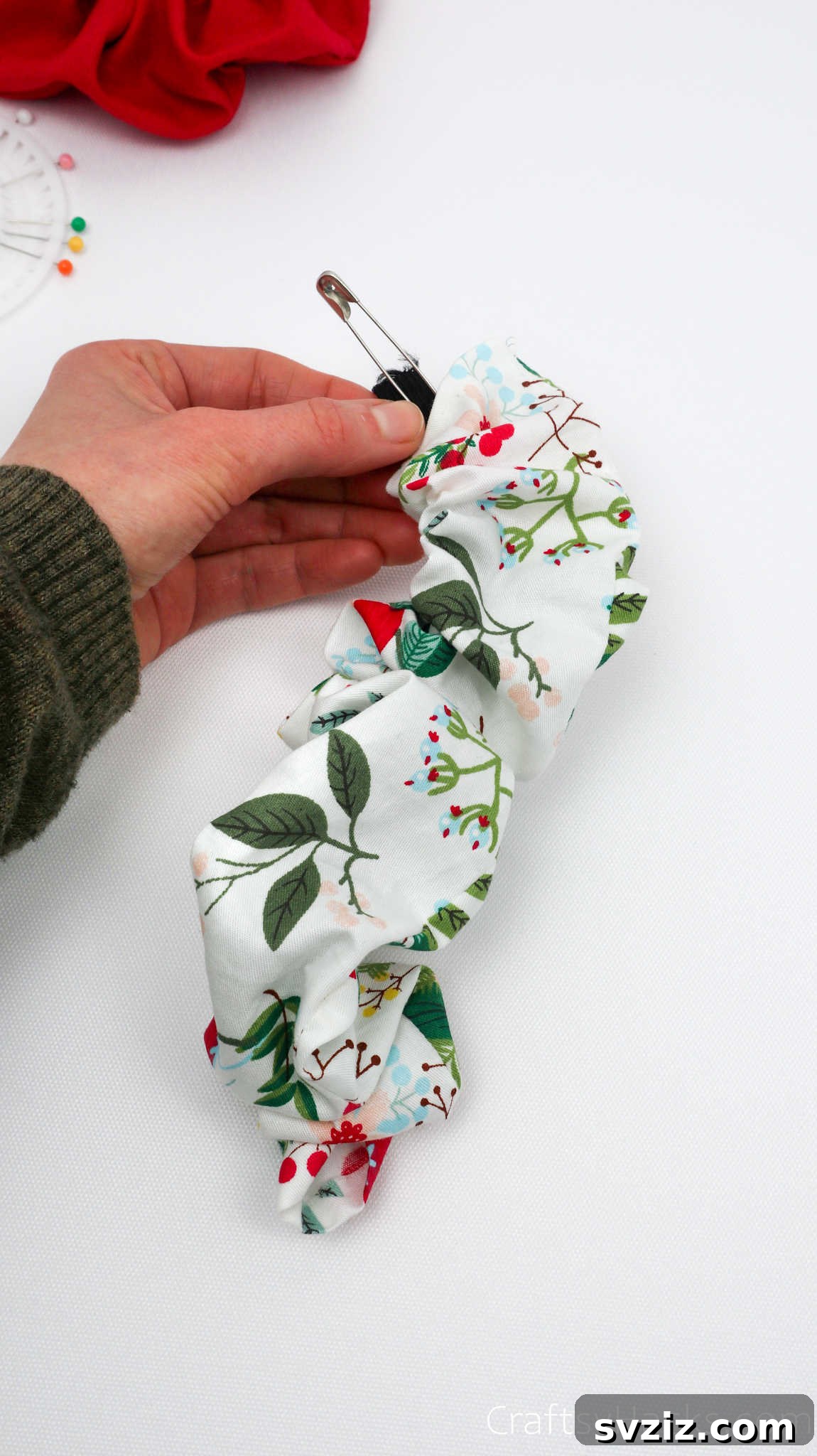 Craft Your Perfect Hair Scrunchie 18 Elastic being pulled through the scrunchie fabric