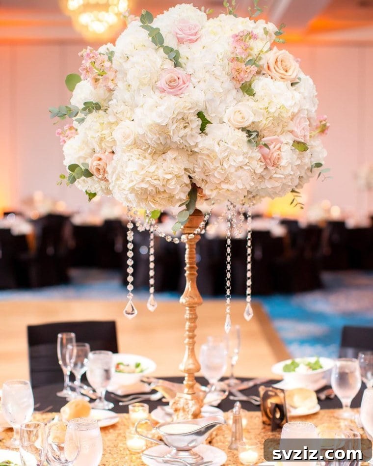 25 Gorgeous Wedding Centerpiece Inspirations 17 Elegant Metal Flower Stand with Pearls
