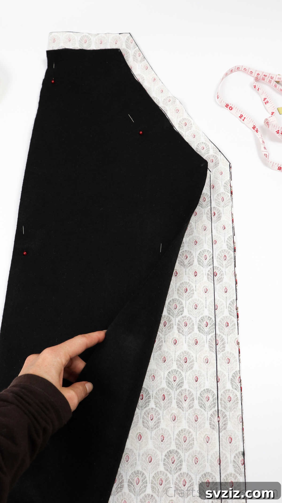 Craft Your Own Custom Apron 19 Removing the black fabric template, revealing the precisely cut main apron fabric ready for the next steps.