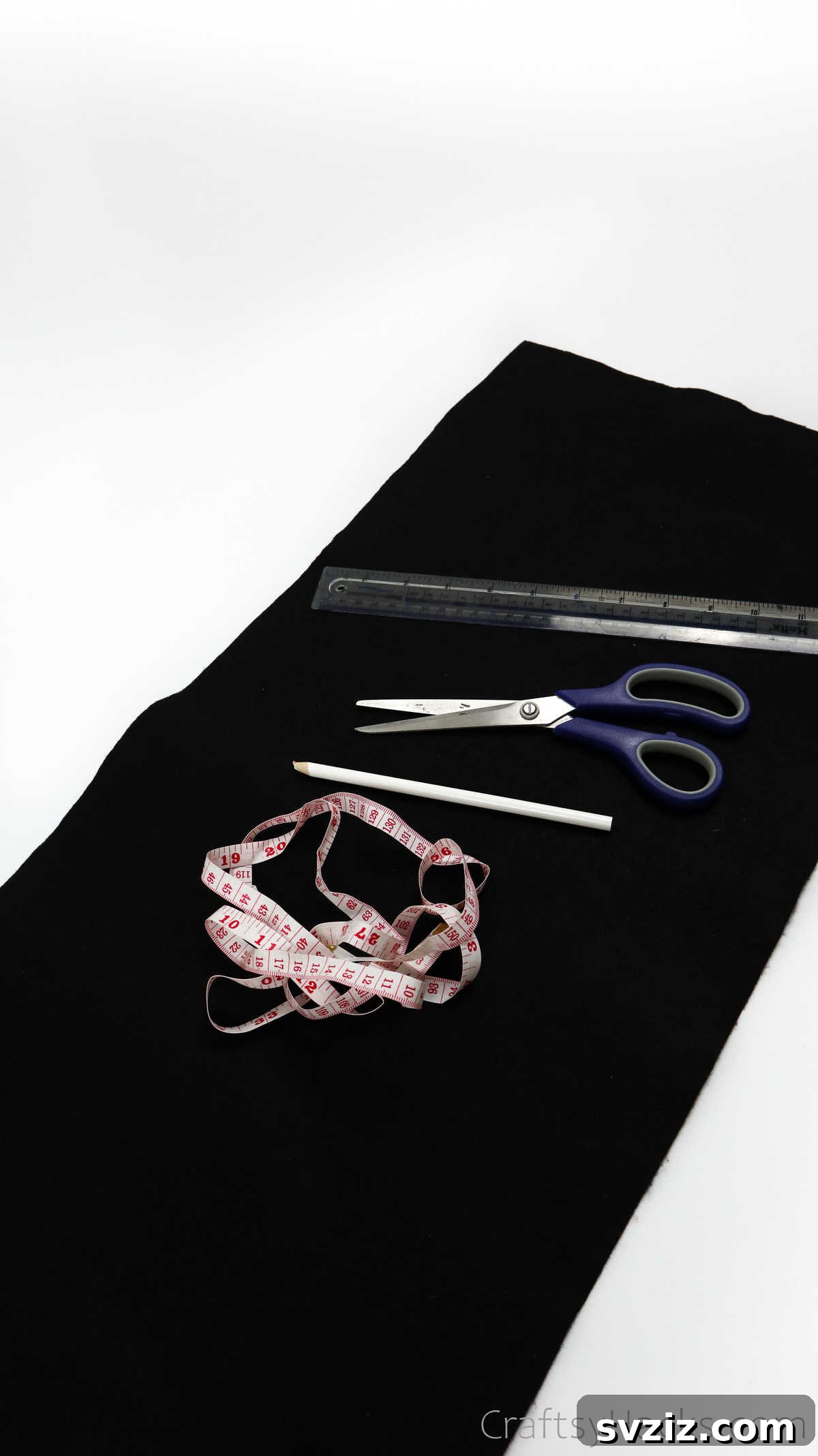 Craft Your Own Custom Apron 6 Essential tools for DIY apron making: a tape measure, scissors, and a ruler laid out on a clean surface, ready for precise fabric work.