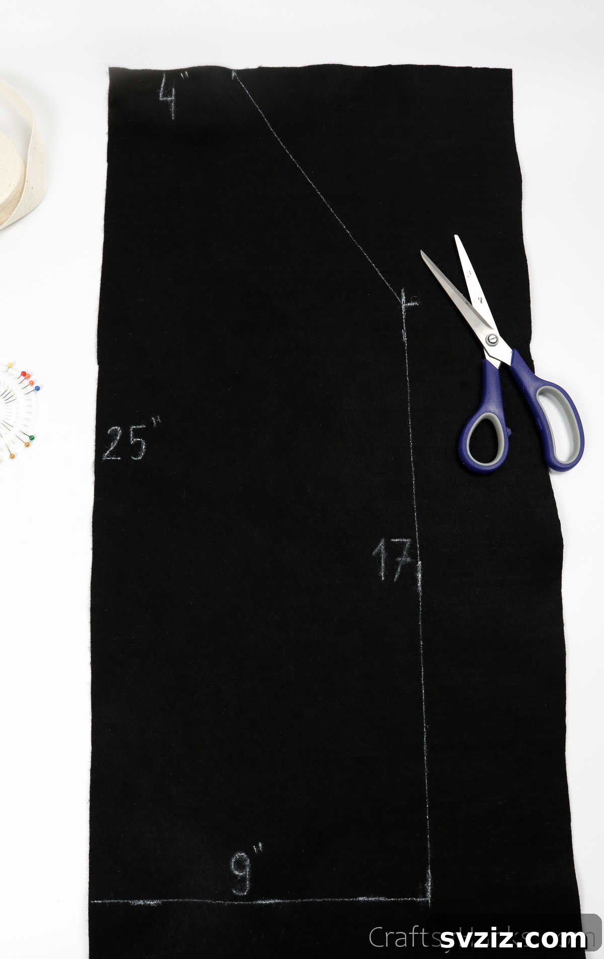 Craft Your Own Custom Apron 7 A crisp white apron template outlined on fabric, ready to be cut and used as a guide for creating a DIY apron.