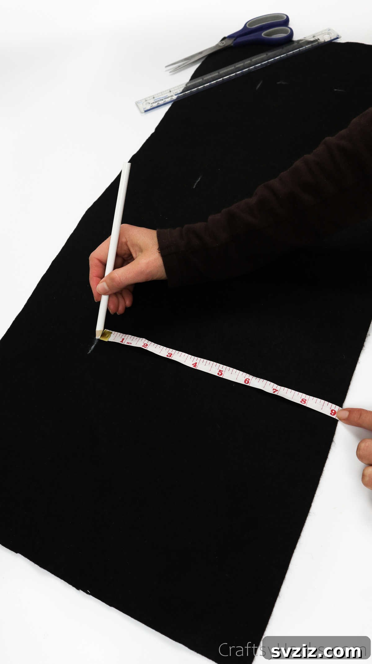 Craft Your Own Custom Apron 8 Tracing a precise line on fabric using a fabric pencil, a key step in creating the unique shape of your DIY apron.
