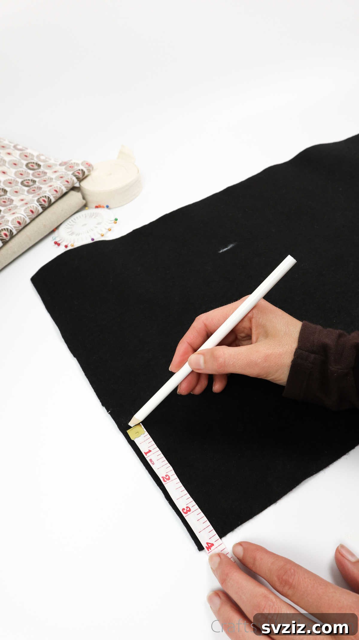 Craft Your Own Custom Apron 10 Precisely marking the apron template with a white fabric pencil, ensuring clear lines for accurate cutting.