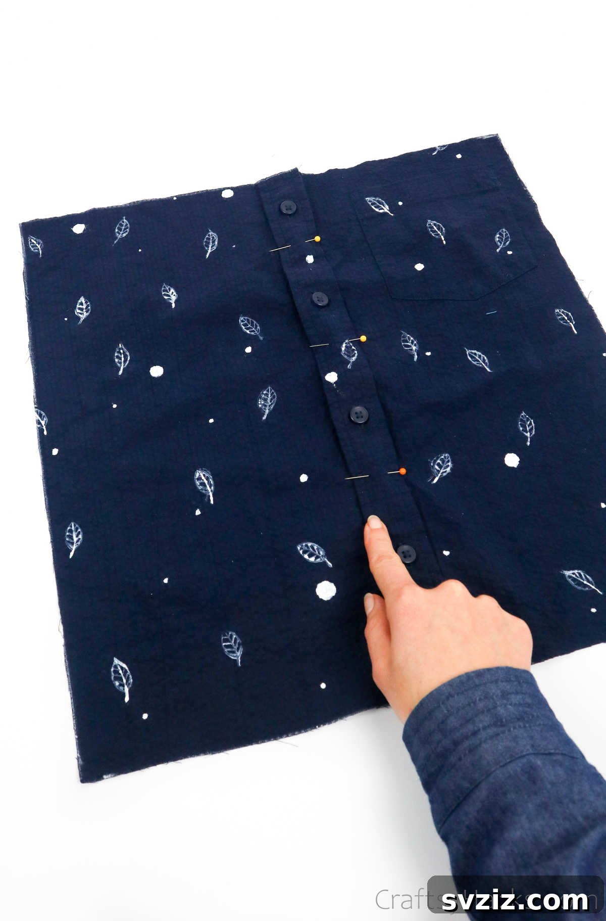 Pinning a button-down shirt's placket to close button gaps before sewing for a tote bag