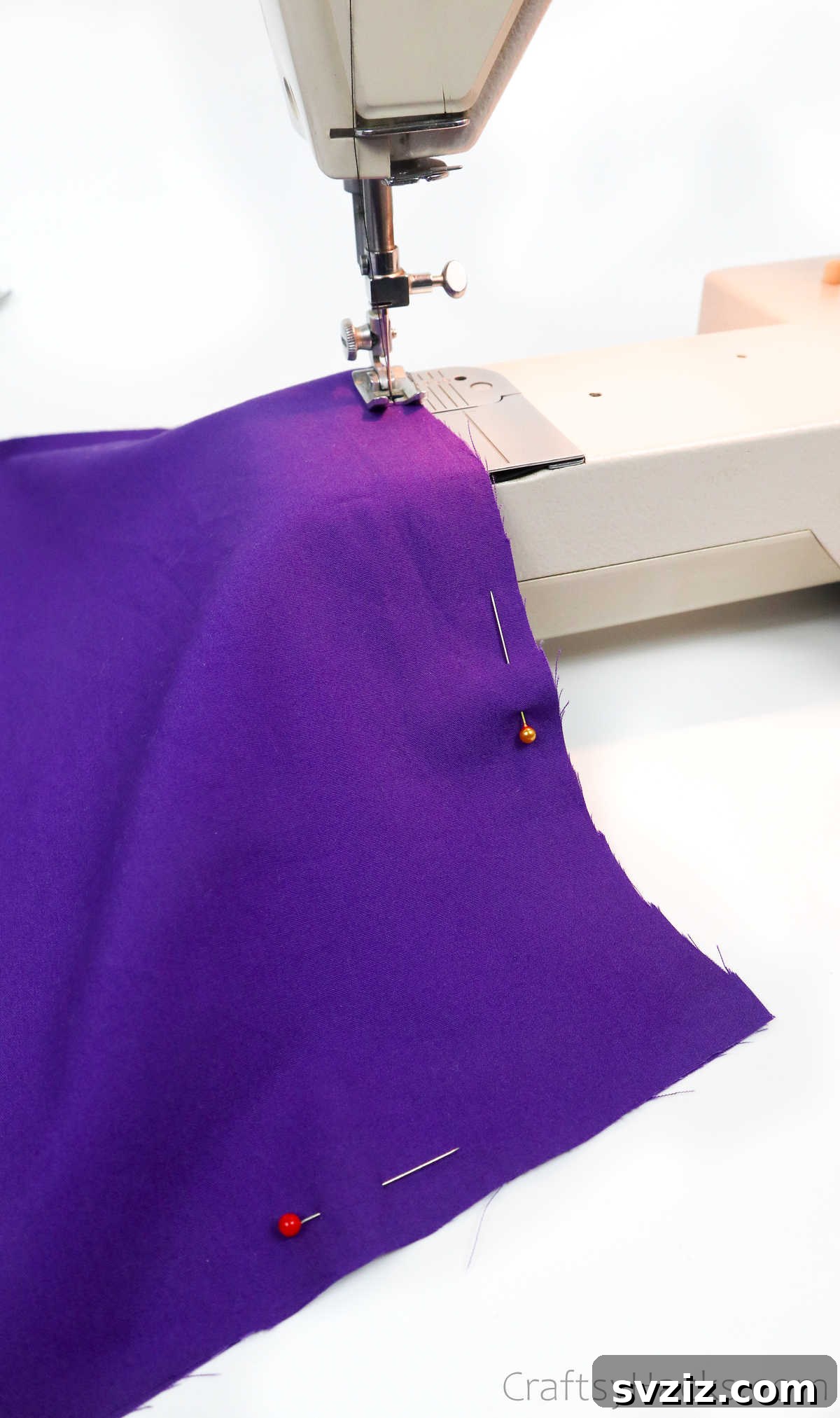 Sewing machine stitching the lining fabric, a key step in creating the tote bag interior