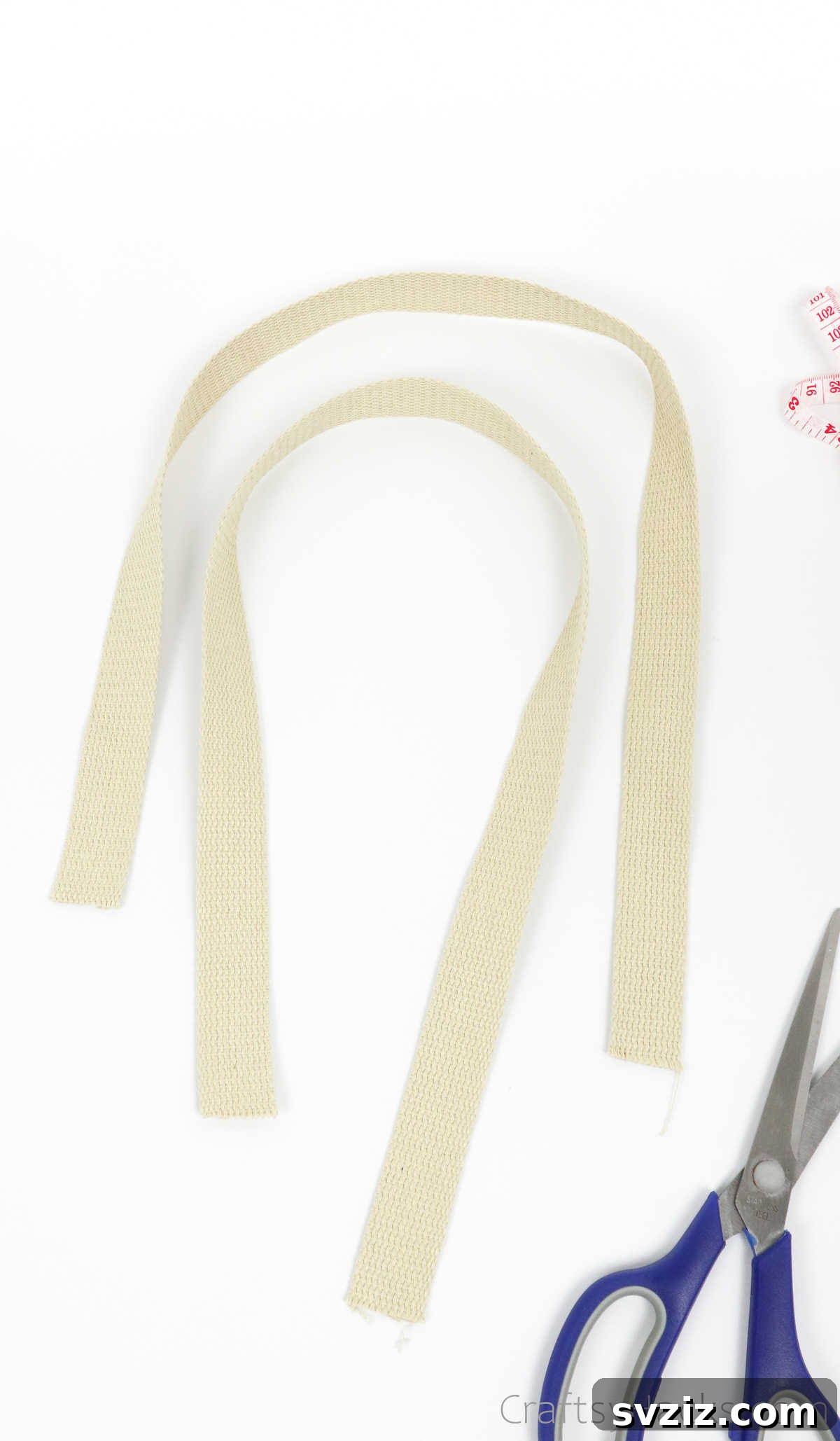 Two strips of cotton webbing, prepared for use as shoulder straps for the DIY tote bag