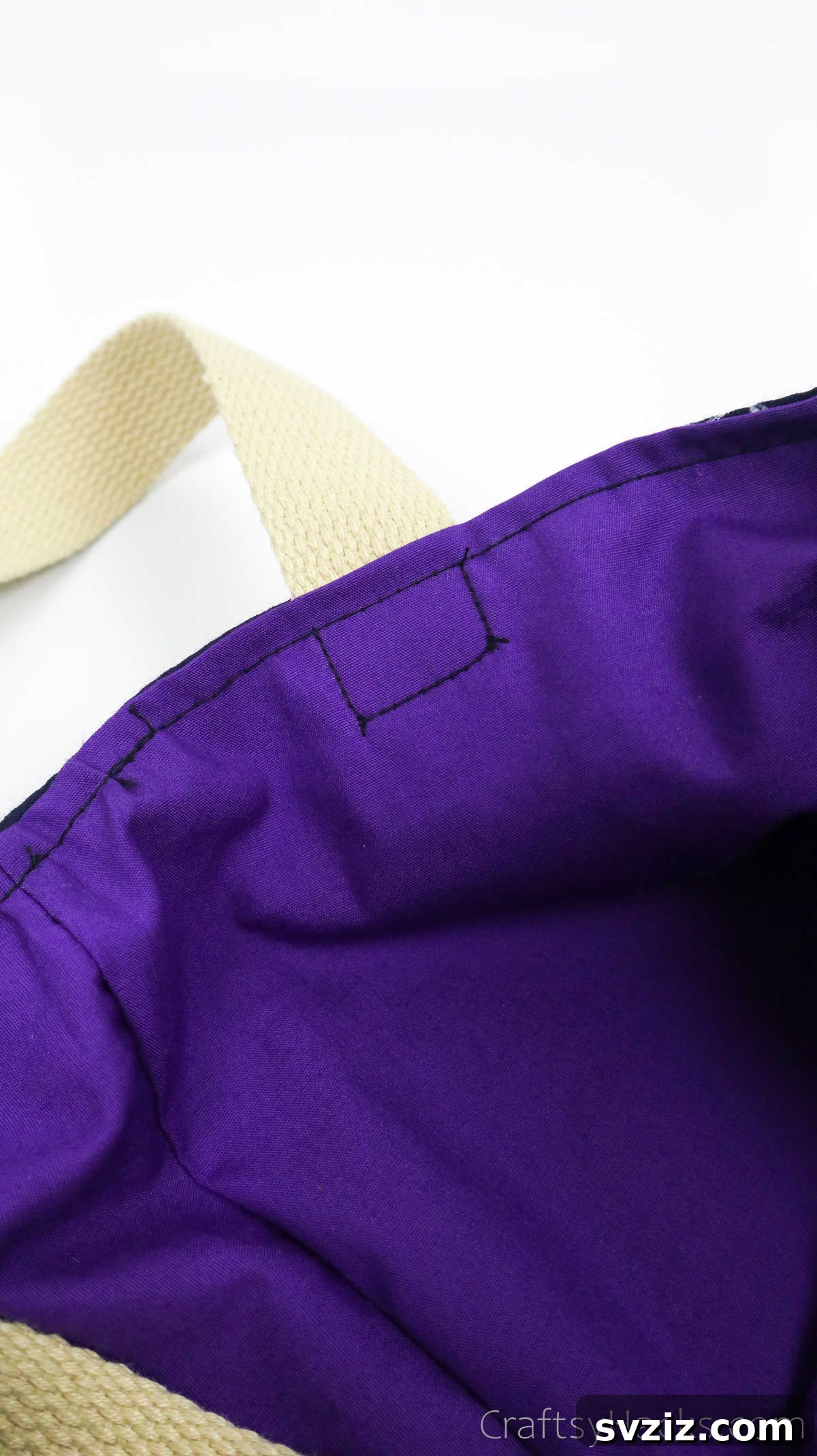 Close-up of a sewn-in strap, reinforced with square stitching for maximum strength
