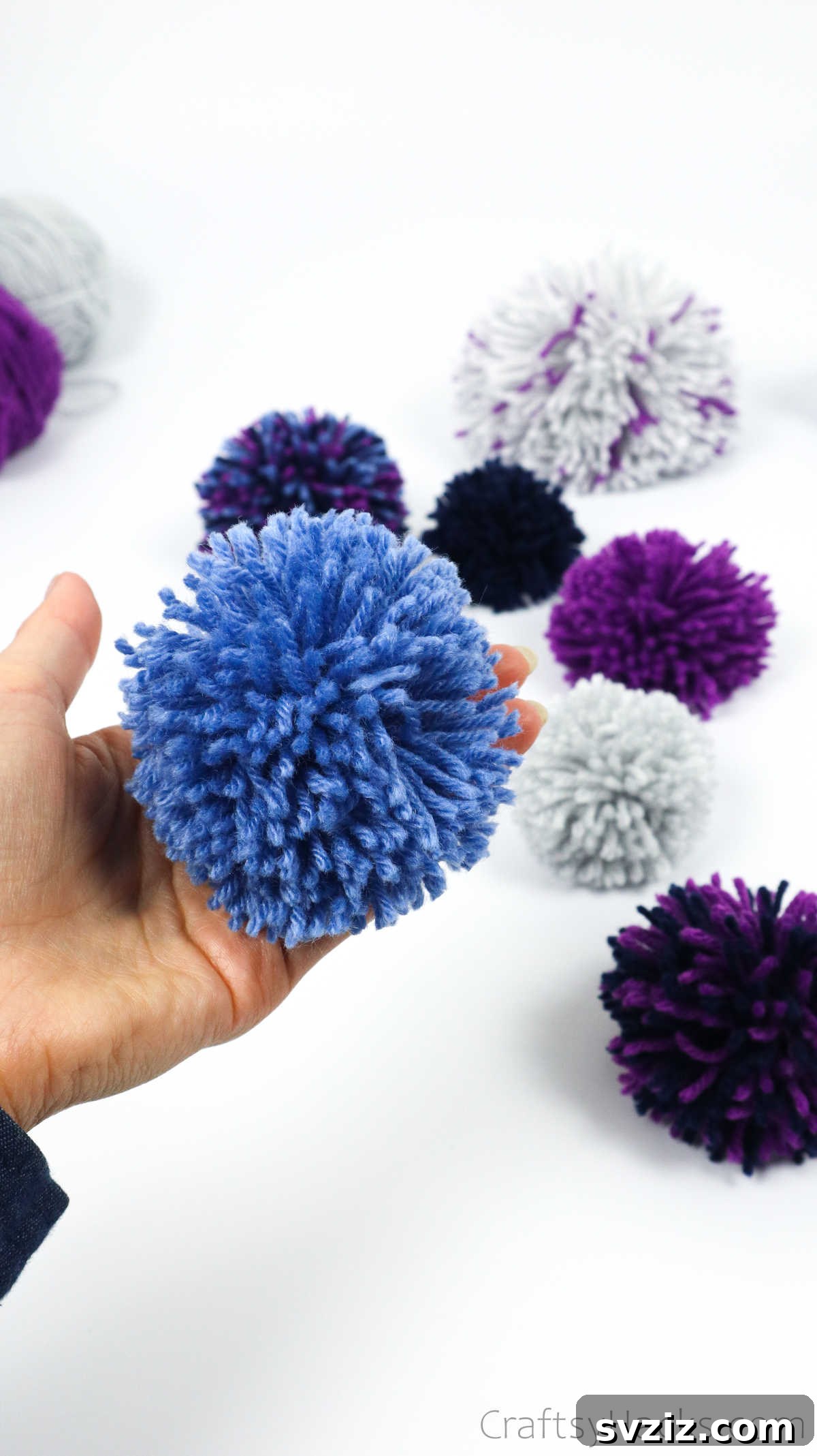 Colorful yarn pom poms ready for crafting