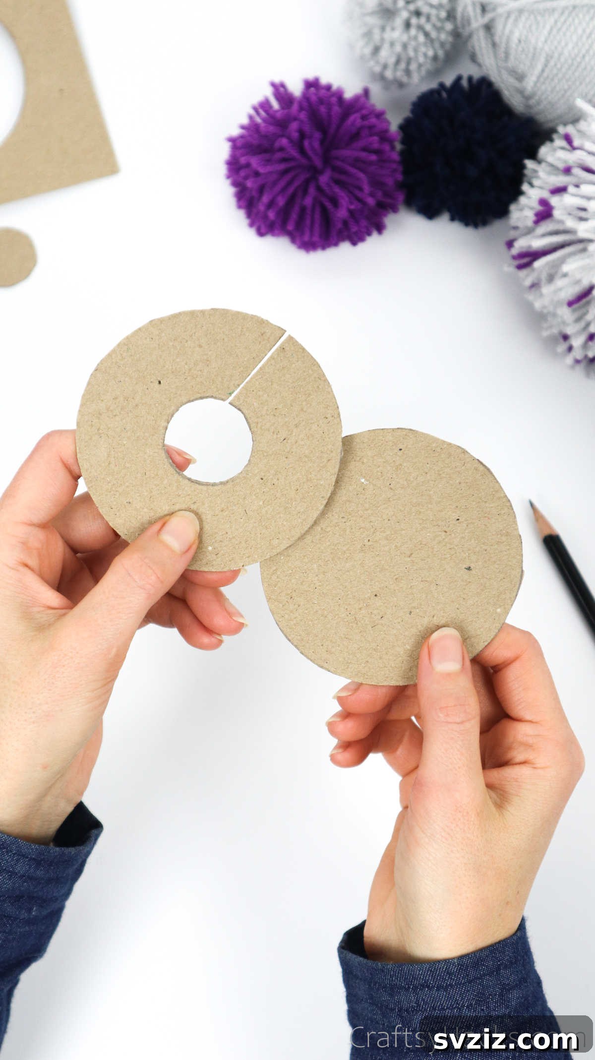 Two cardboard pom pom templates, one a full circle and one a donut shape