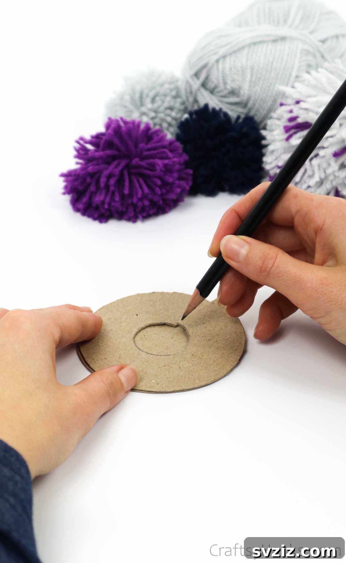 Tracing the inner circle from one cardboard disk onto another