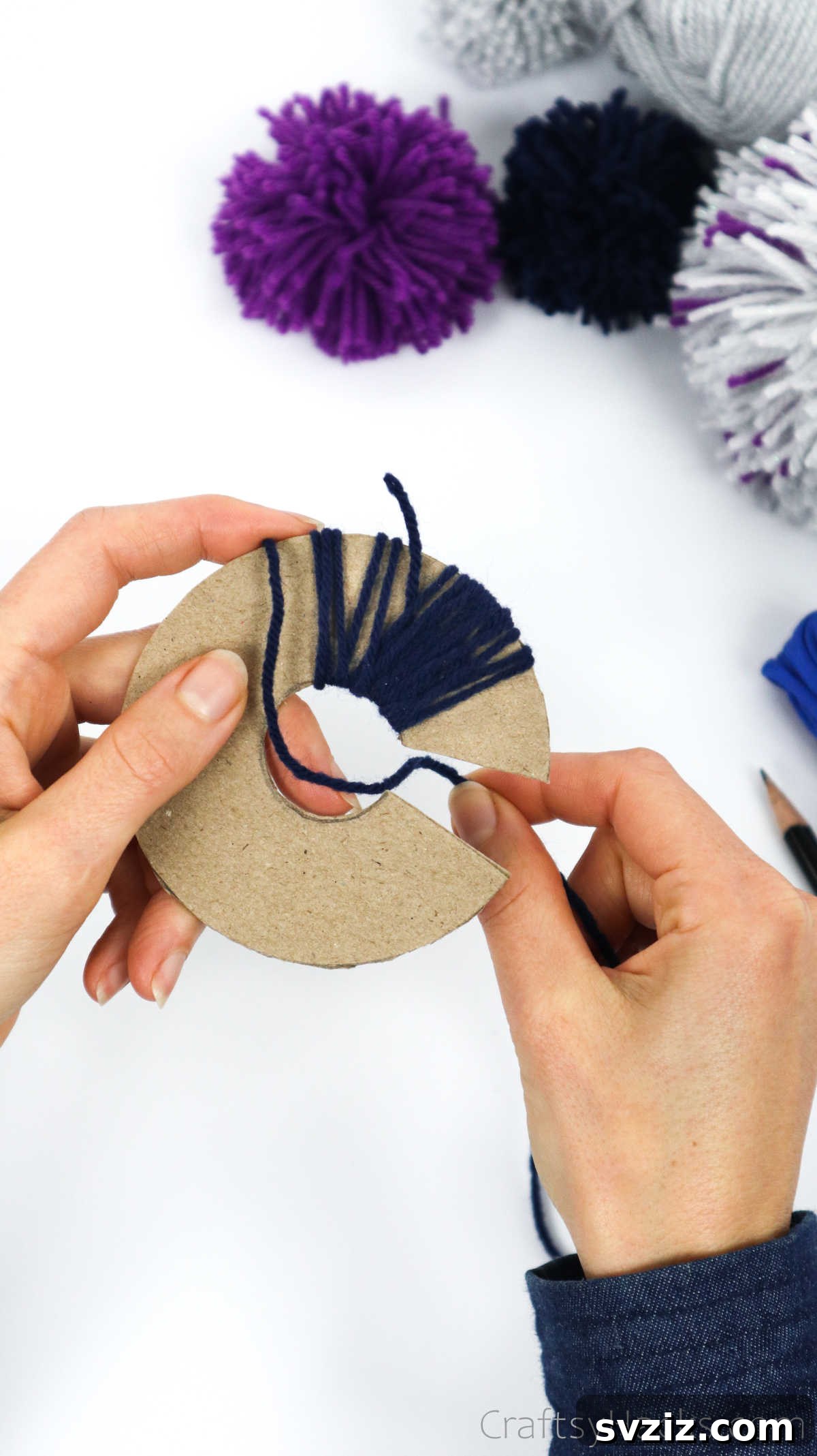Yarn-wrapped cardboard disks nearing completion