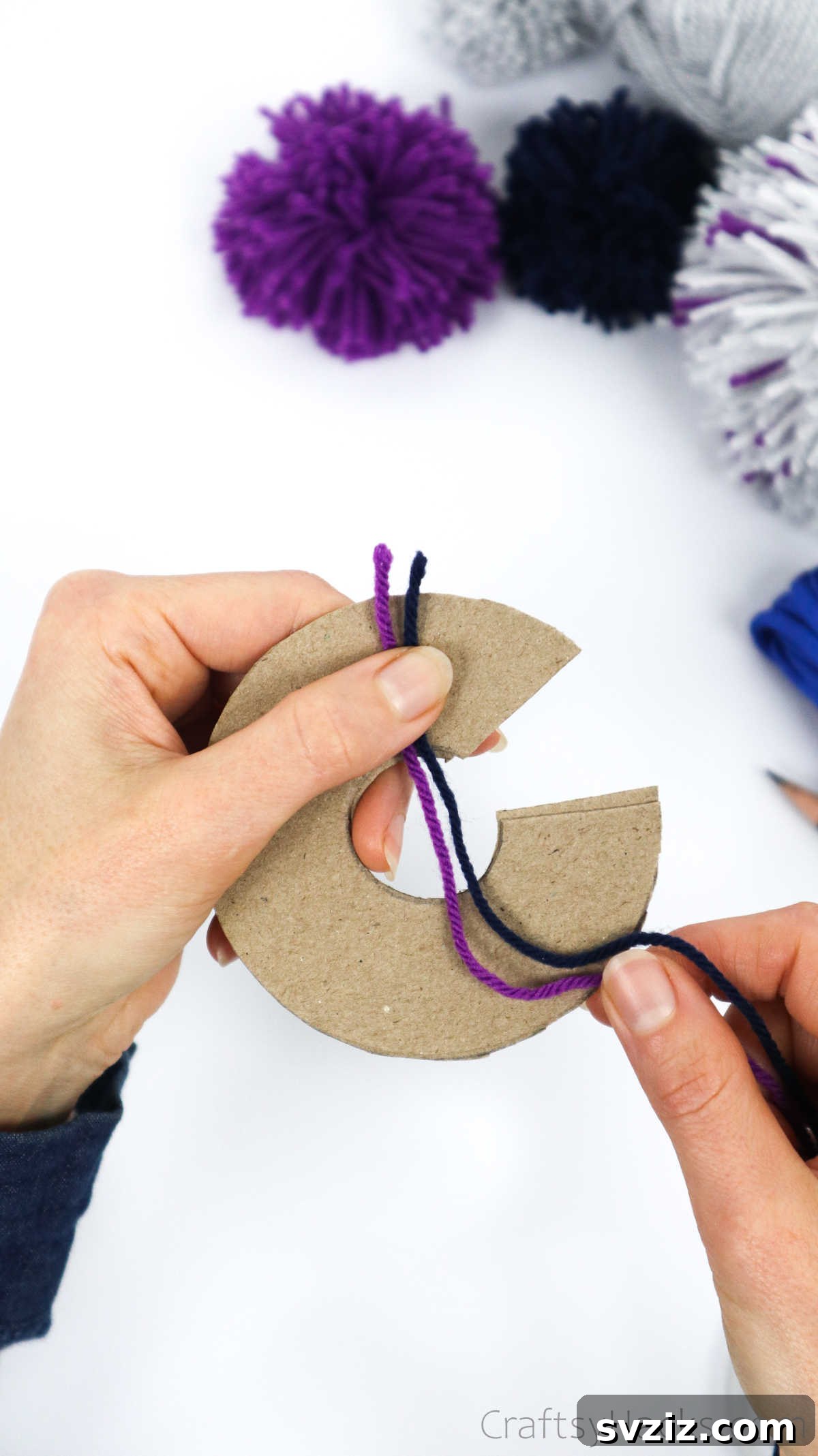 Wrapping two strands of different colored yarn together for a blended effect