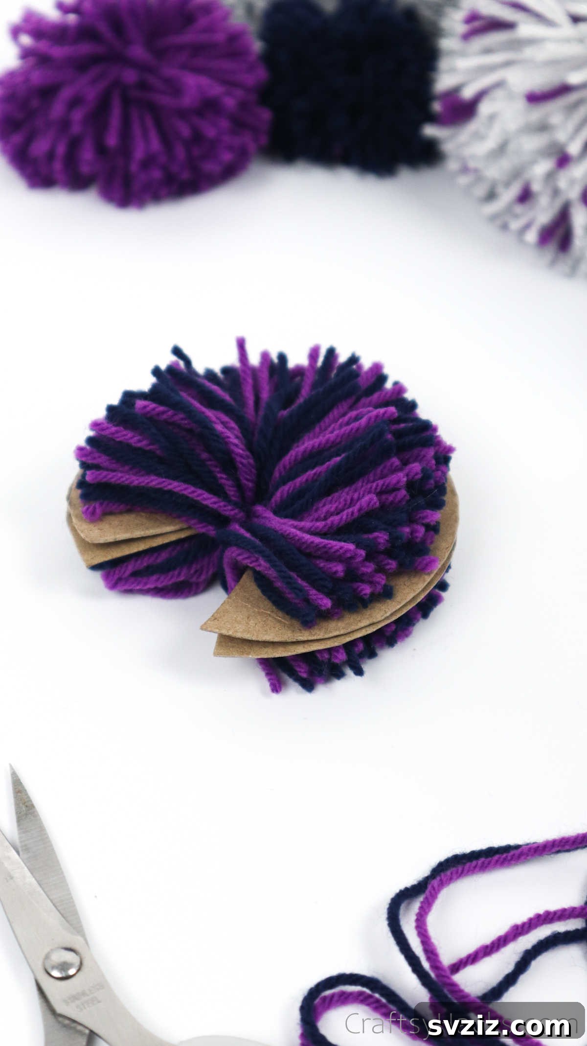 The yarn-covered disks after all strands have been cut, resembling a bristly ring