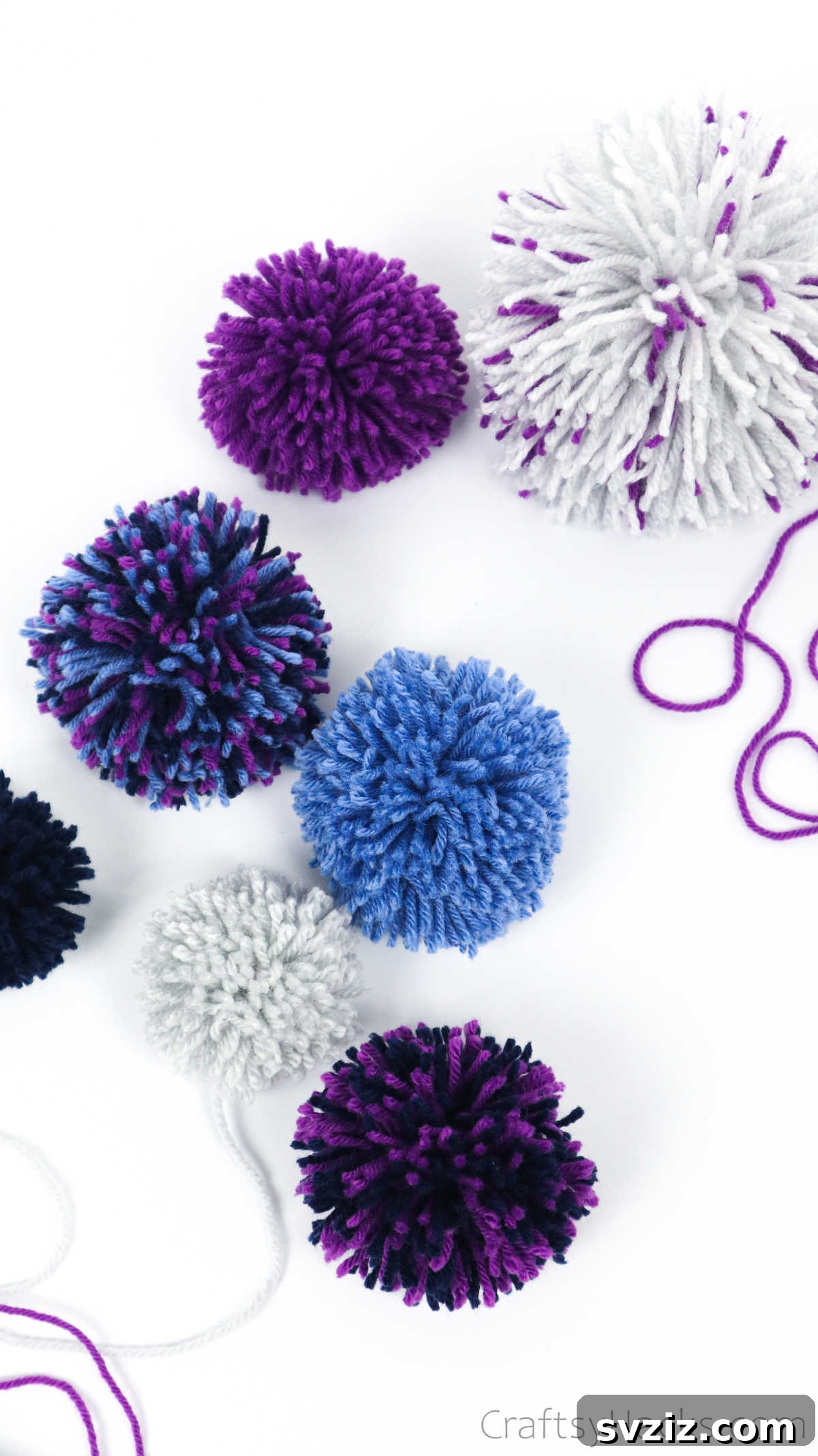 Assorted yarn pom poms in various sizes and colors, showcasing different levels of fluffiness