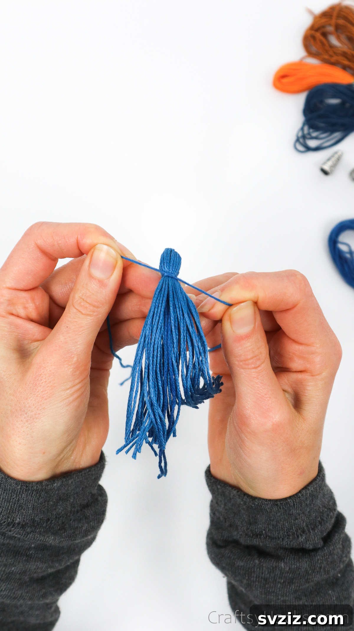 Craft Your Own Trendy Tassel Earrings 18 tying thread