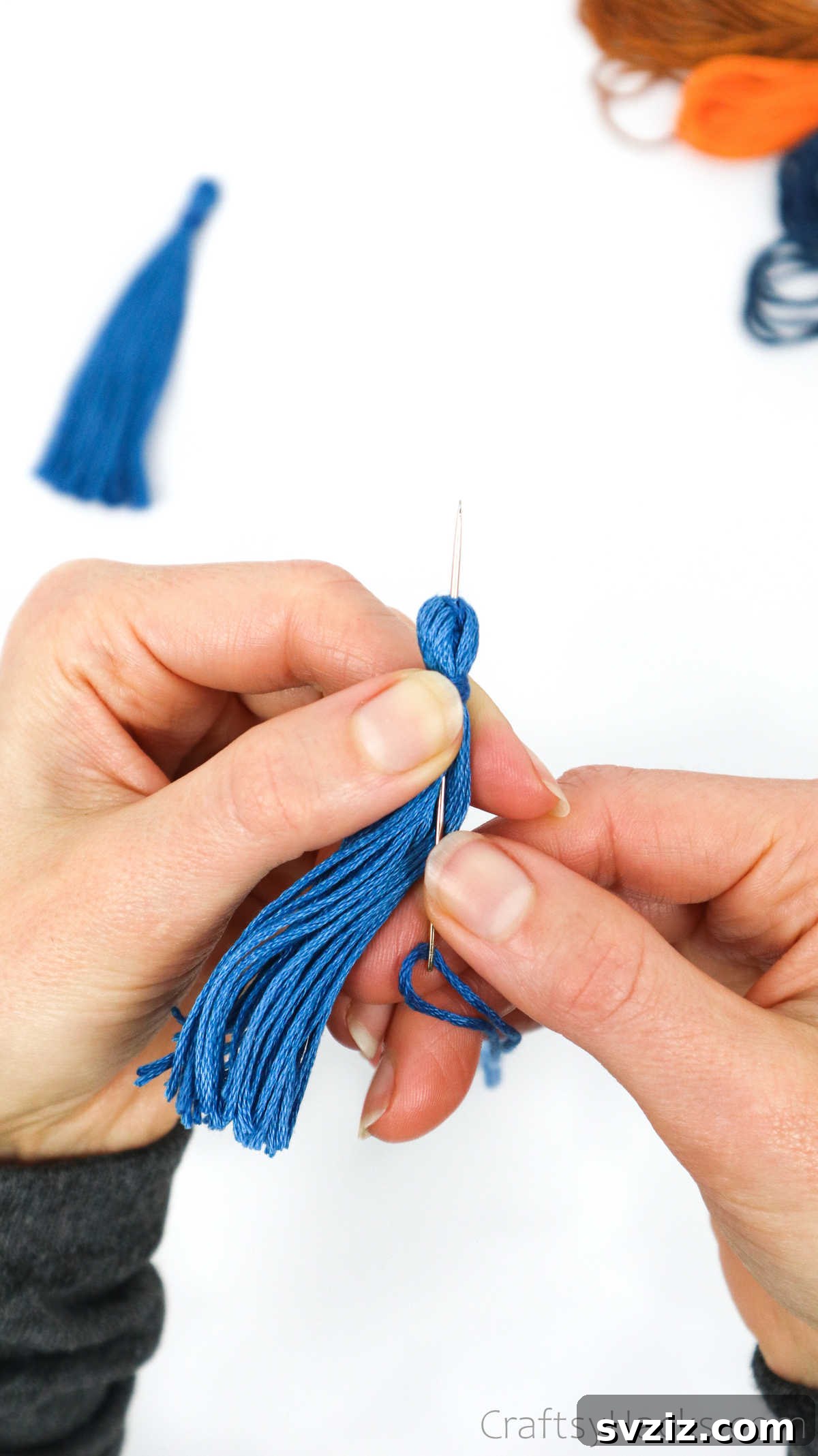 Craft Your Own Trendy Tassel Earrings 27 putting needle through thread