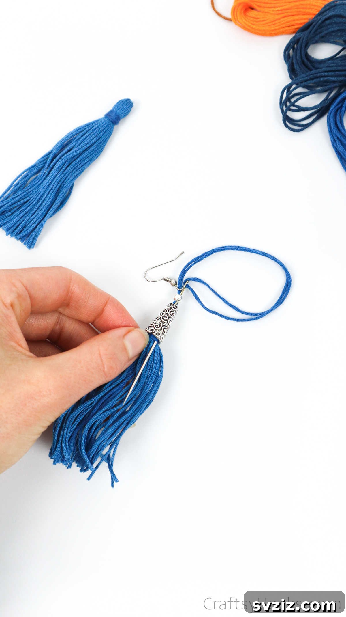 Craft Your Own Trendy Tassel Earrings 36 bringing needle back through