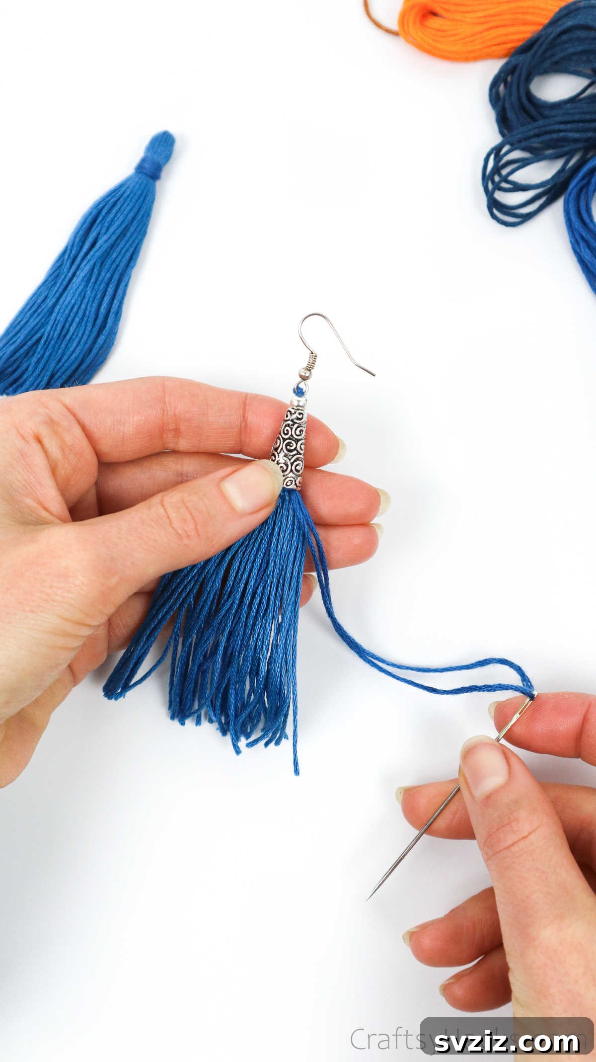 Craft Your Own Trendy Tassel Earrings 37 holding tassel earring