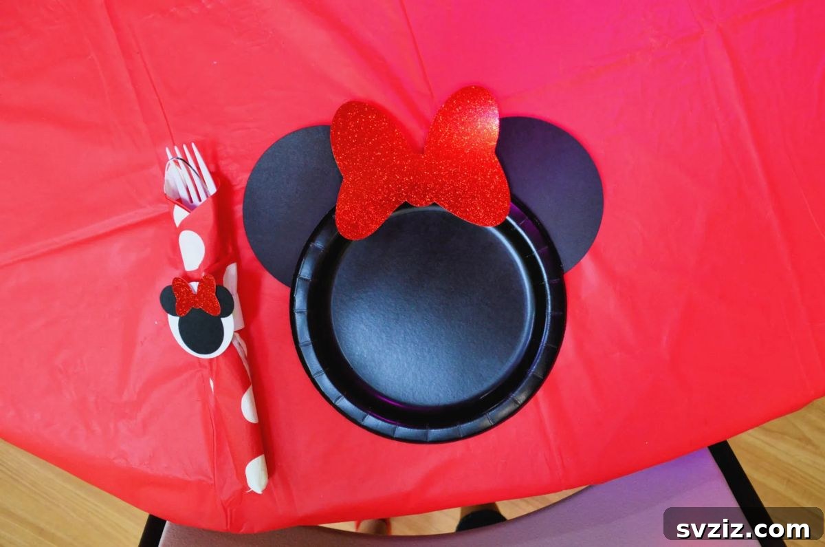 Crafting Smiles: Paper Plate Fun for Kids 14 Classic Minnie Mouse paper plate craft featuring her iconic black ears and a sparkly red bow.