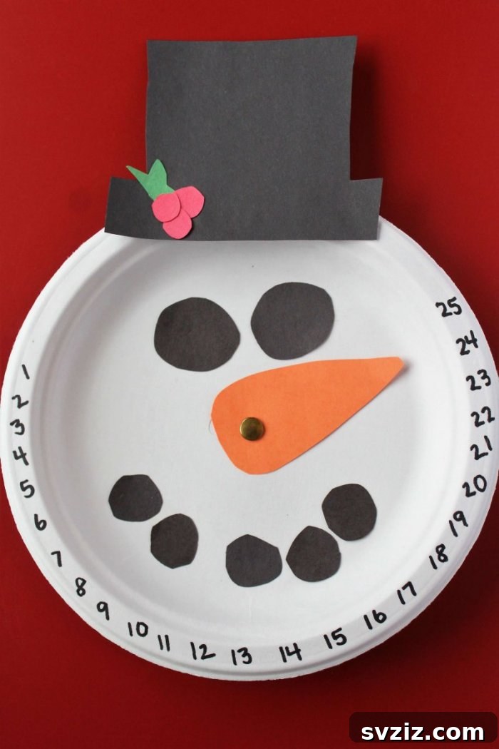 Crafting Smiles: Paper Plate Fun for Kids 24 Cheerful paper plate snowman Christmas countdown craft with movable numbers and festive decorations.