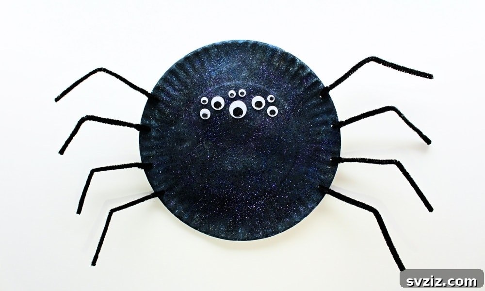 Crafting Smiles: Paper Plate Fun for Kids 37 Spooky yet fun paper plate spider craft with multiple googly eyes and pipe cleaner legs, great for Halloween.