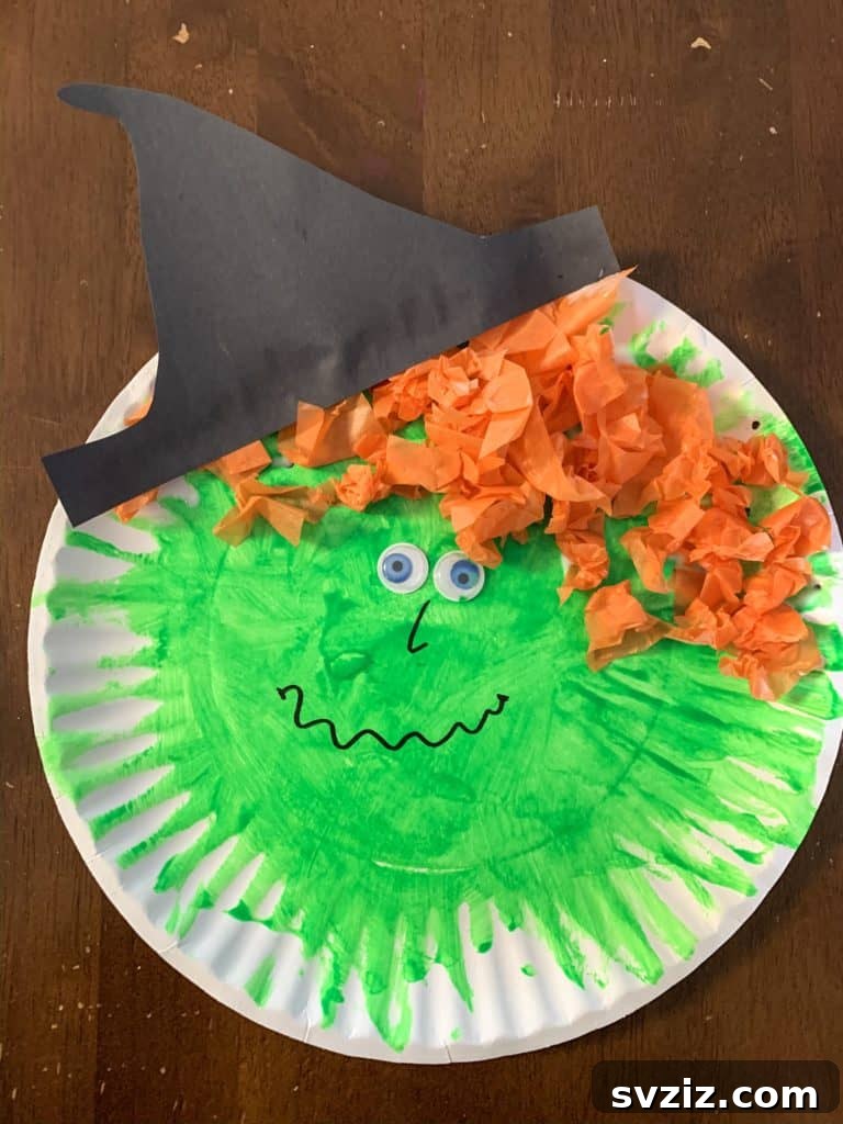 Crafting Smiles: Paper Plate Fun for Kids 5 Friendly paper plate witch craft with a green face, googly eyes, and orange tissue paper hair.
