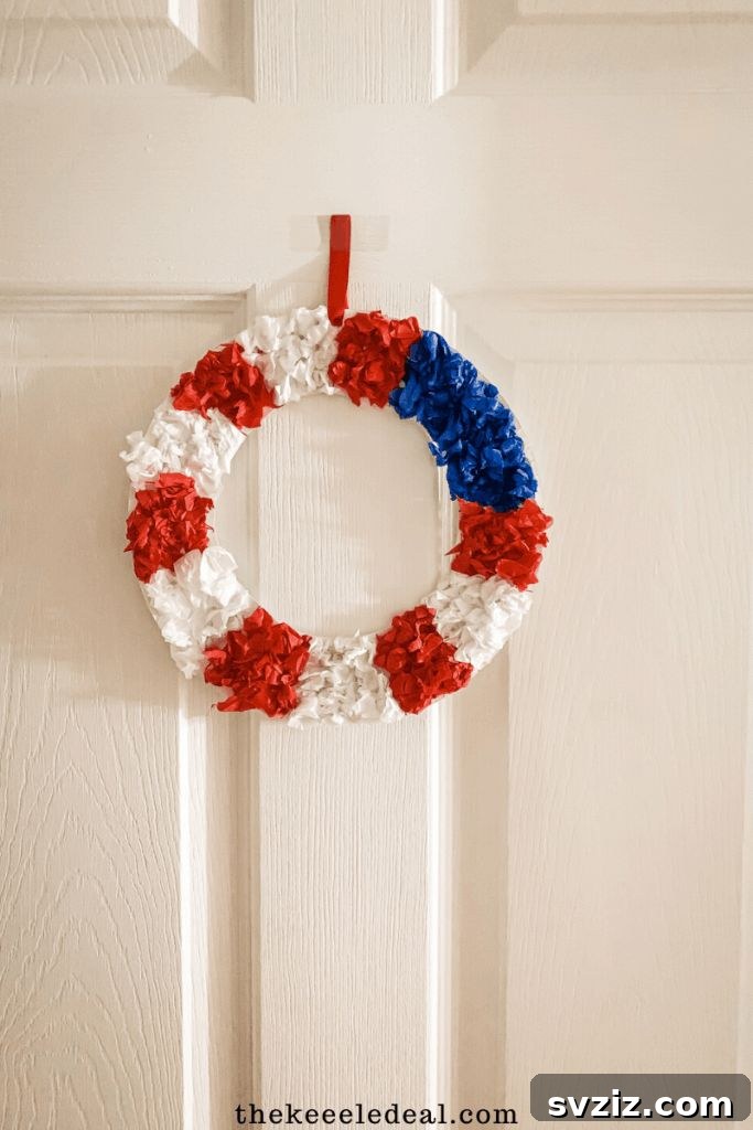 Crafting Smiles: Paper Plate Fun for Kids 48 Red, white, and blue paper plate patriotic wreath with star embellishments, perfect for national holidays.