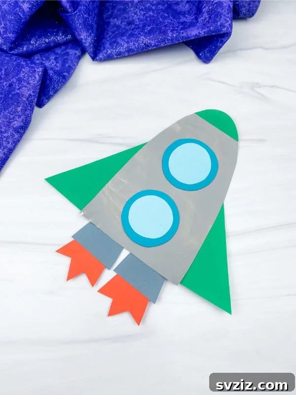 Crafting Smiles: Paper Plate Fun for Kids 6 Colorful paper plate rocket craft with flames, stars, and a window, ready for an imaginary space adventure.
