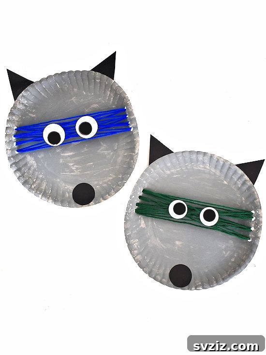Crafting Smiles: Paper Plate Fun for Kids 10 Adorable paper plate raccoon craft with masked eyes, a fluffy tail, and threaded yarn details.