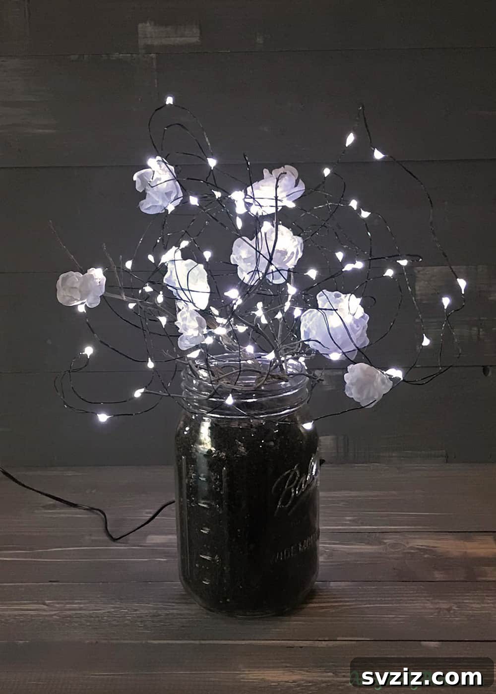 Effortless Elegance: 51 DIY Party Decor Ideas 48 Enchanting Mason Jar Lamps with Illuminated Flowers