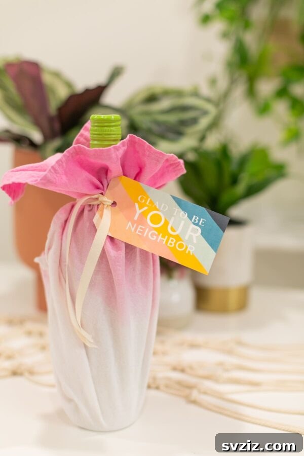 51 Heartfelt DIY Gifts for Their New Beginning 14 Eco-friendly wrapped wine bottle with a personalized tag
